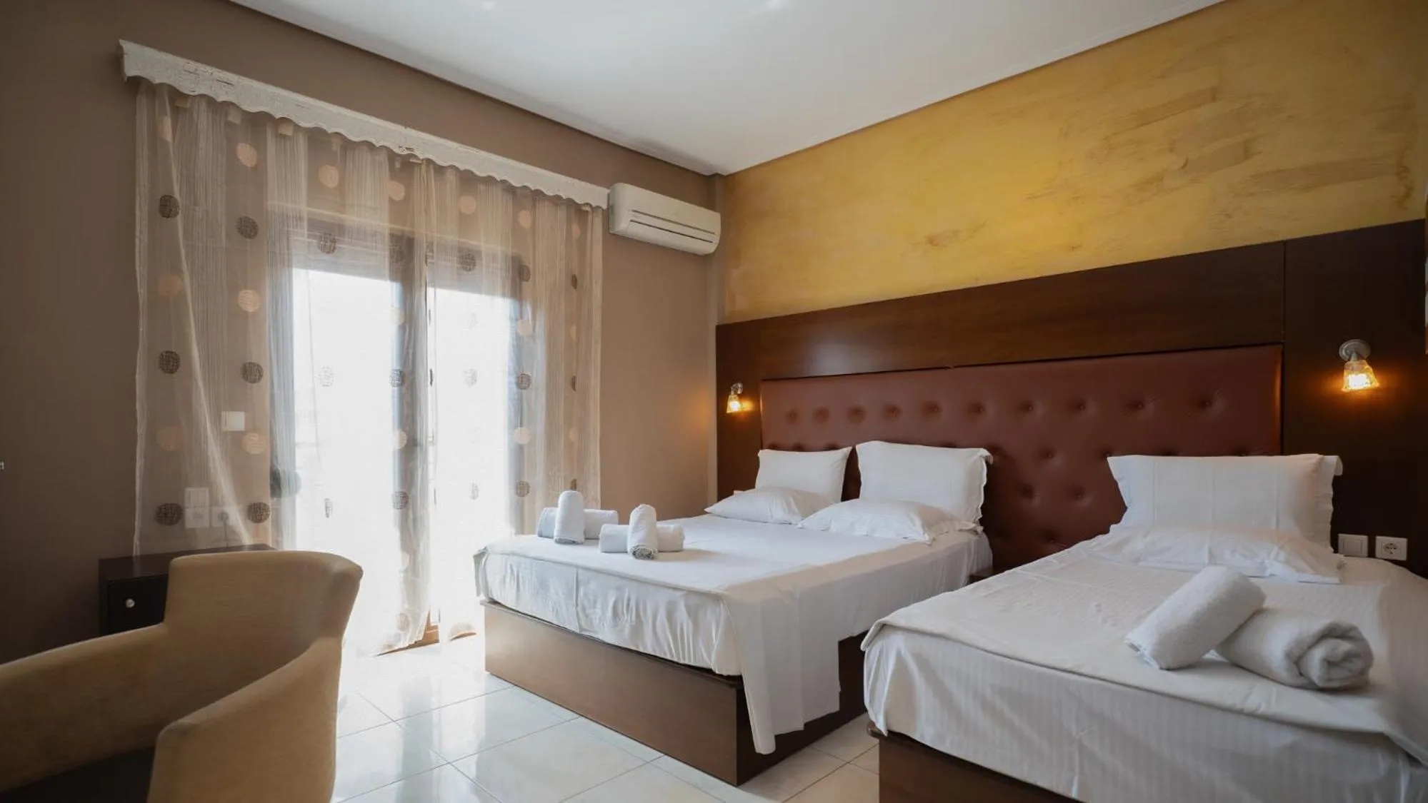 Bed in Toti Boutique Rooms