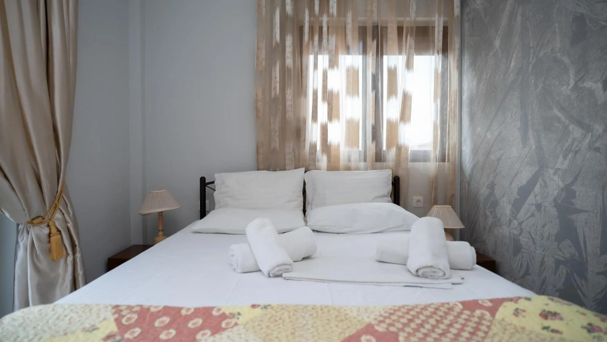 Bed in Toti Boutique Rooms