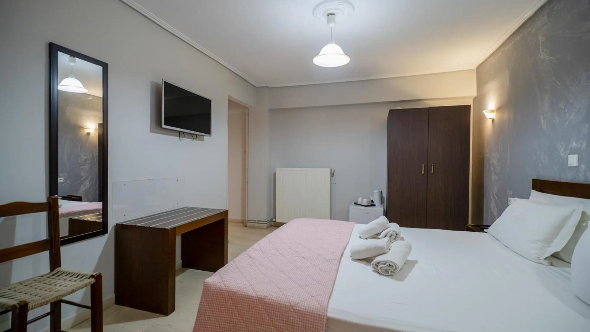 Bed in Toti Boutique Rooms