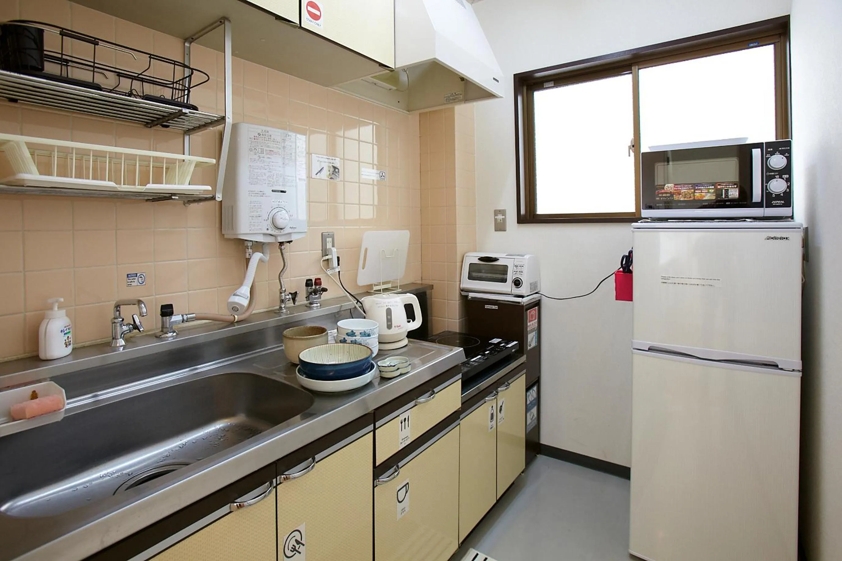 Communal kitchen in Bonfire Hostel Osaka