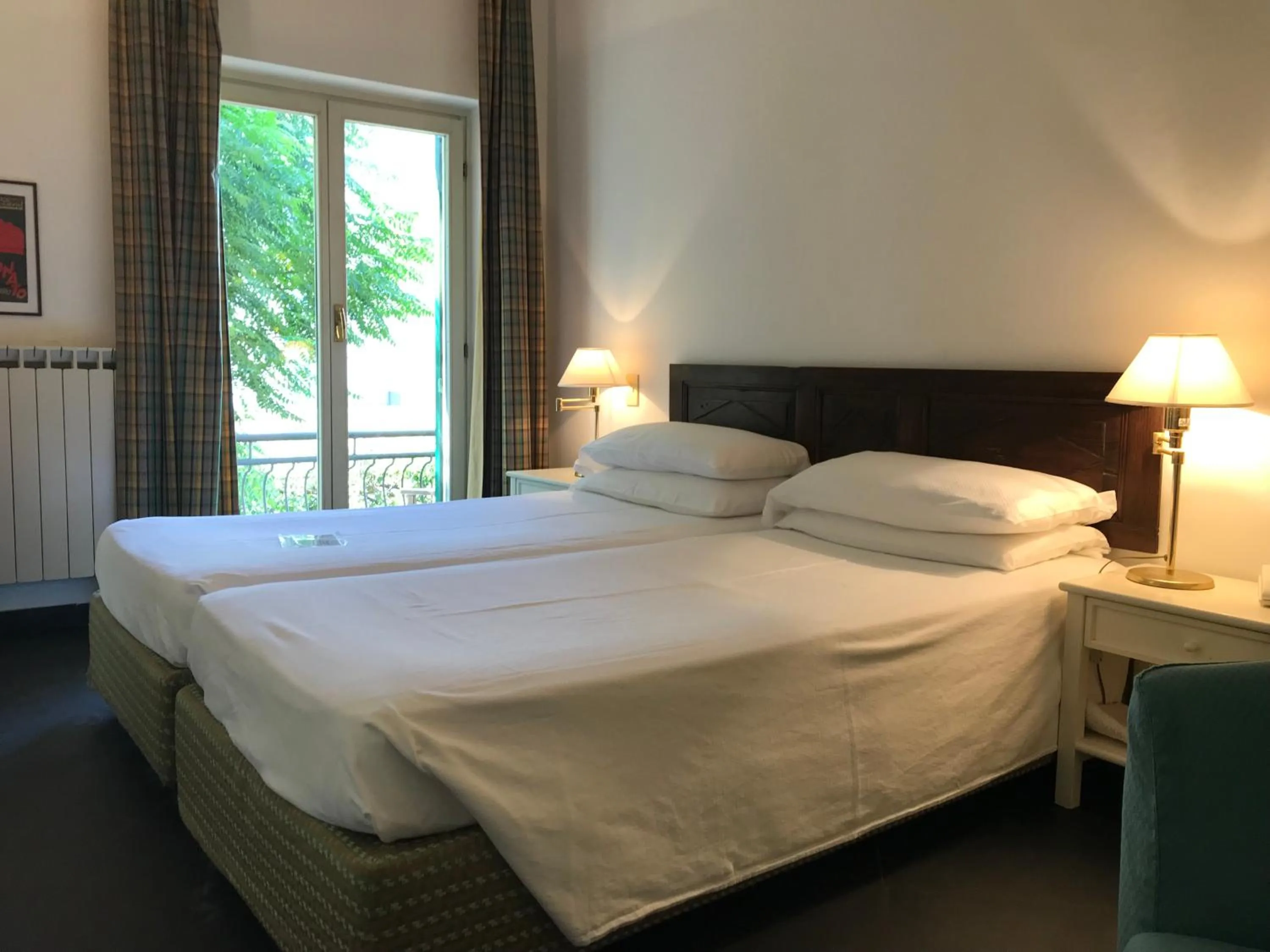 Bed in Hotel Beau Rivage