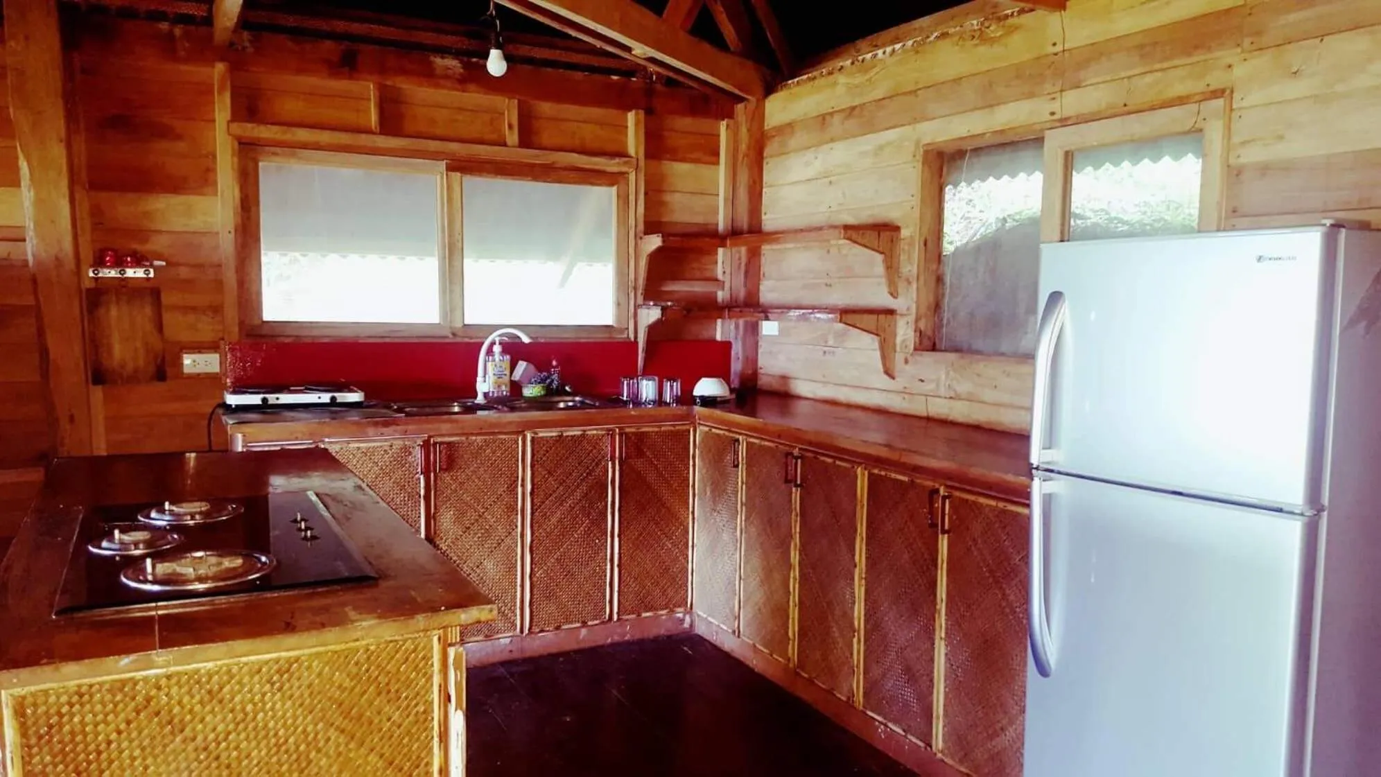 Kitchen or kitchenette in White Beach Front and Cottages