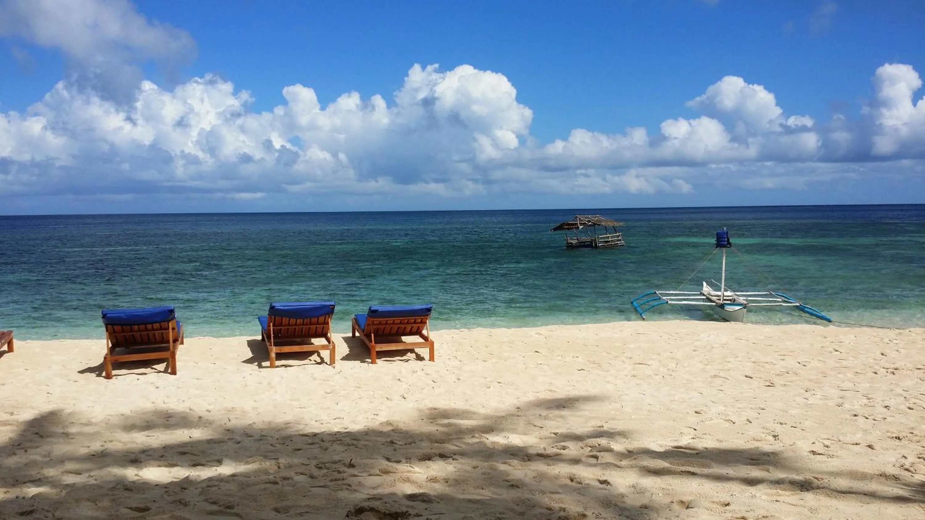 Seating area in White Beach Front and Cottages