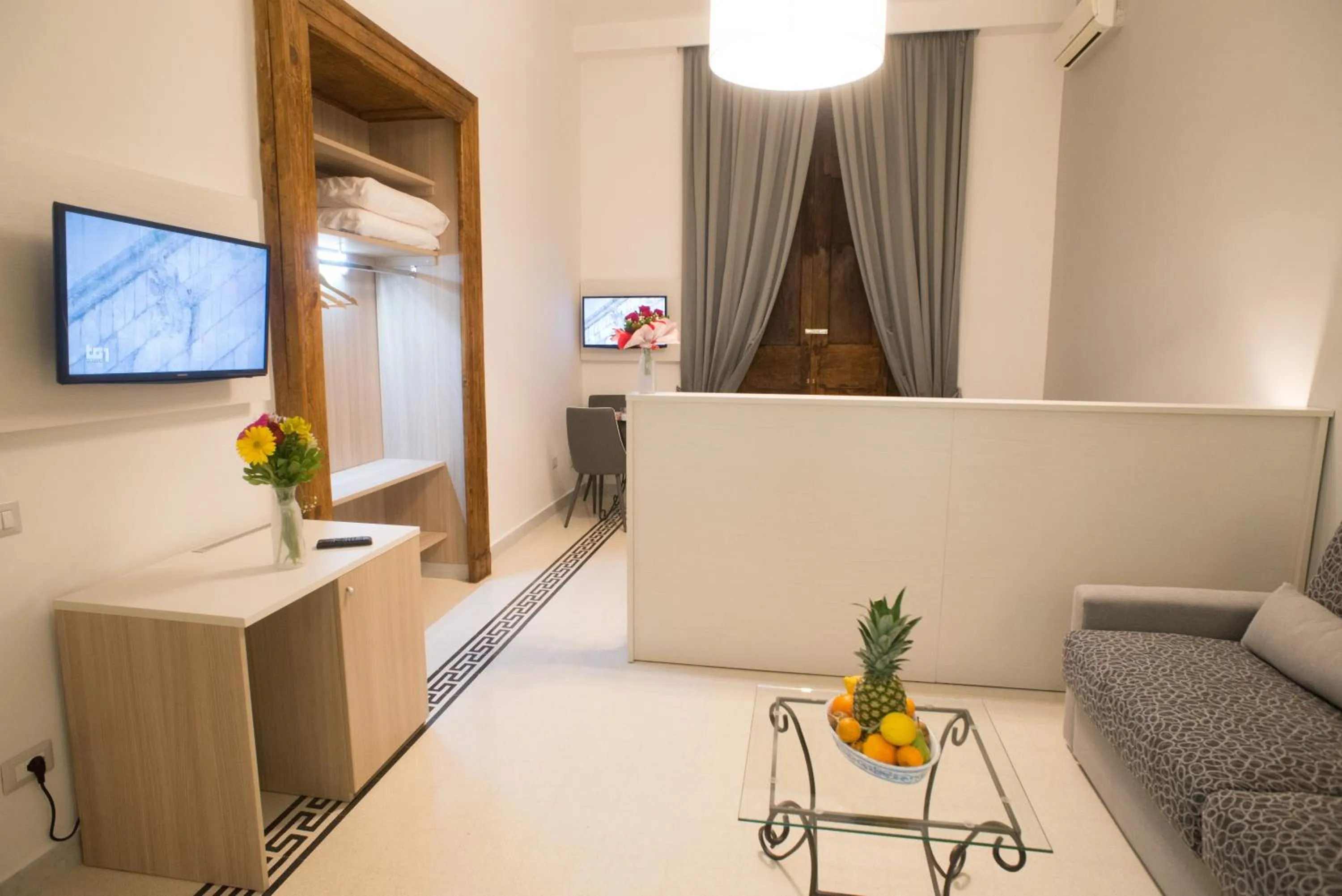 Seating area, Bed in B&B Napolimilionaria Foria 242