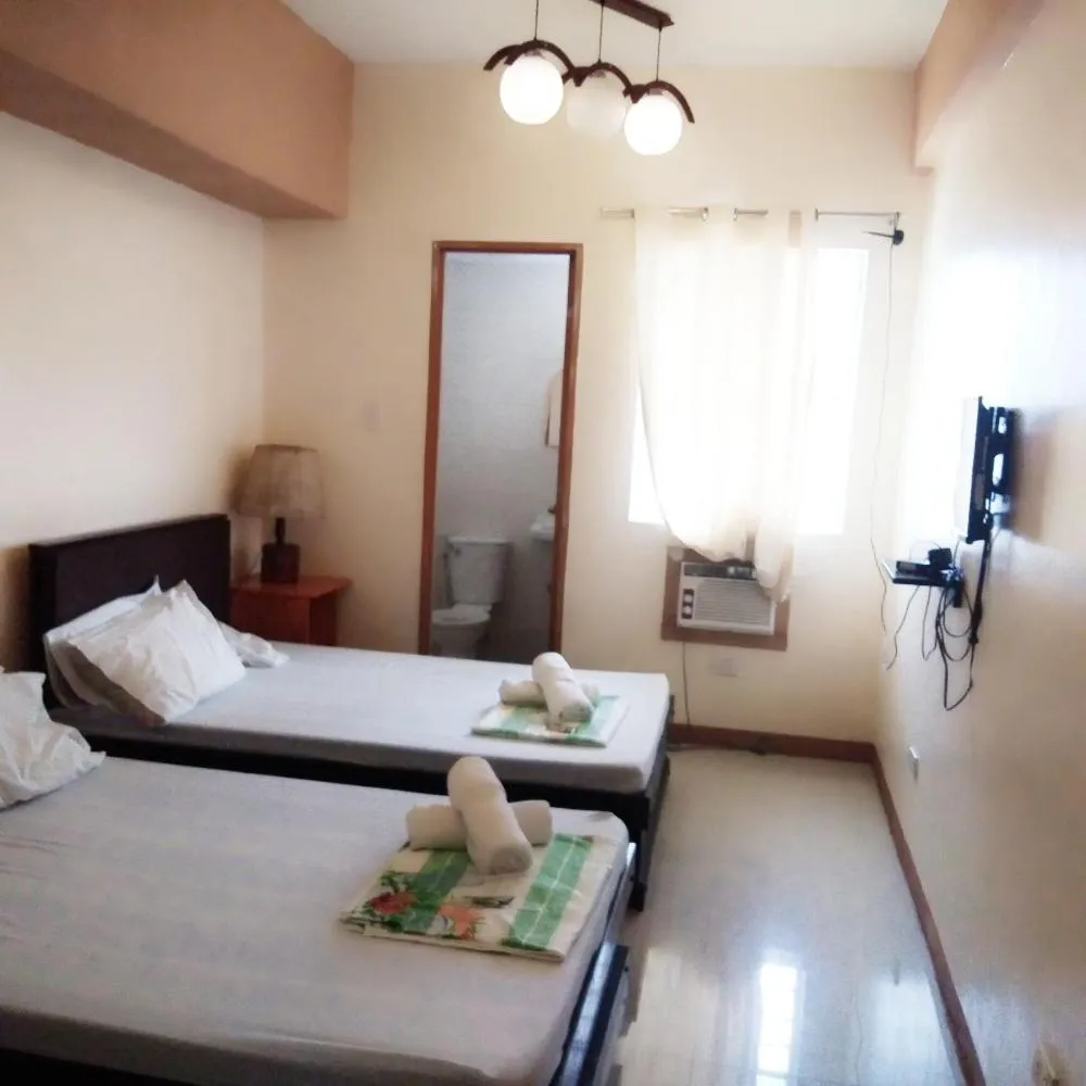 Photo of the whole room, Bed in AAM Transient and Guest House