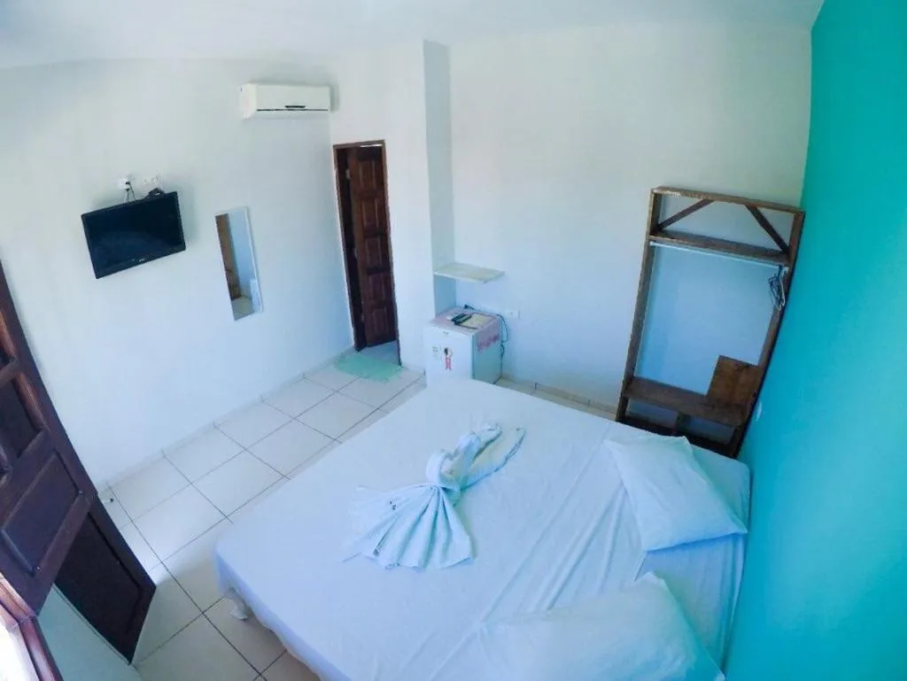 Bed in Pousada Velosmar