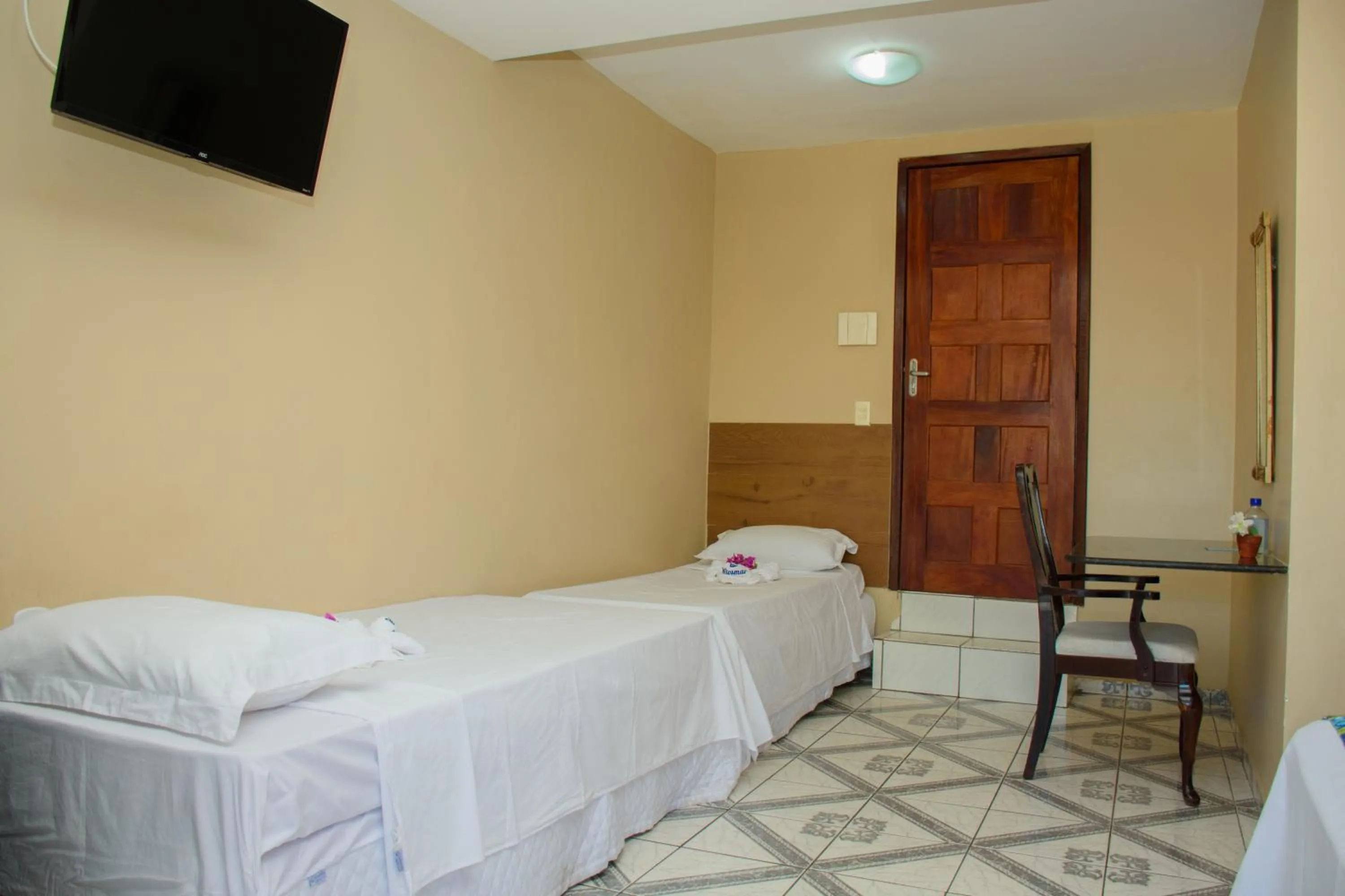 Bed in Pousada Velosmar