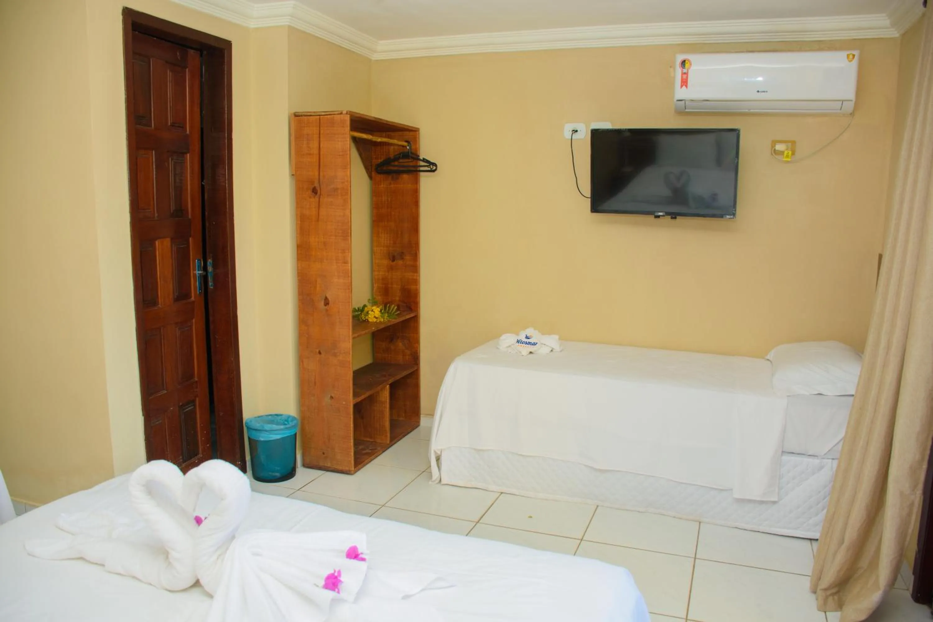 Bed in Pousada Velosmar