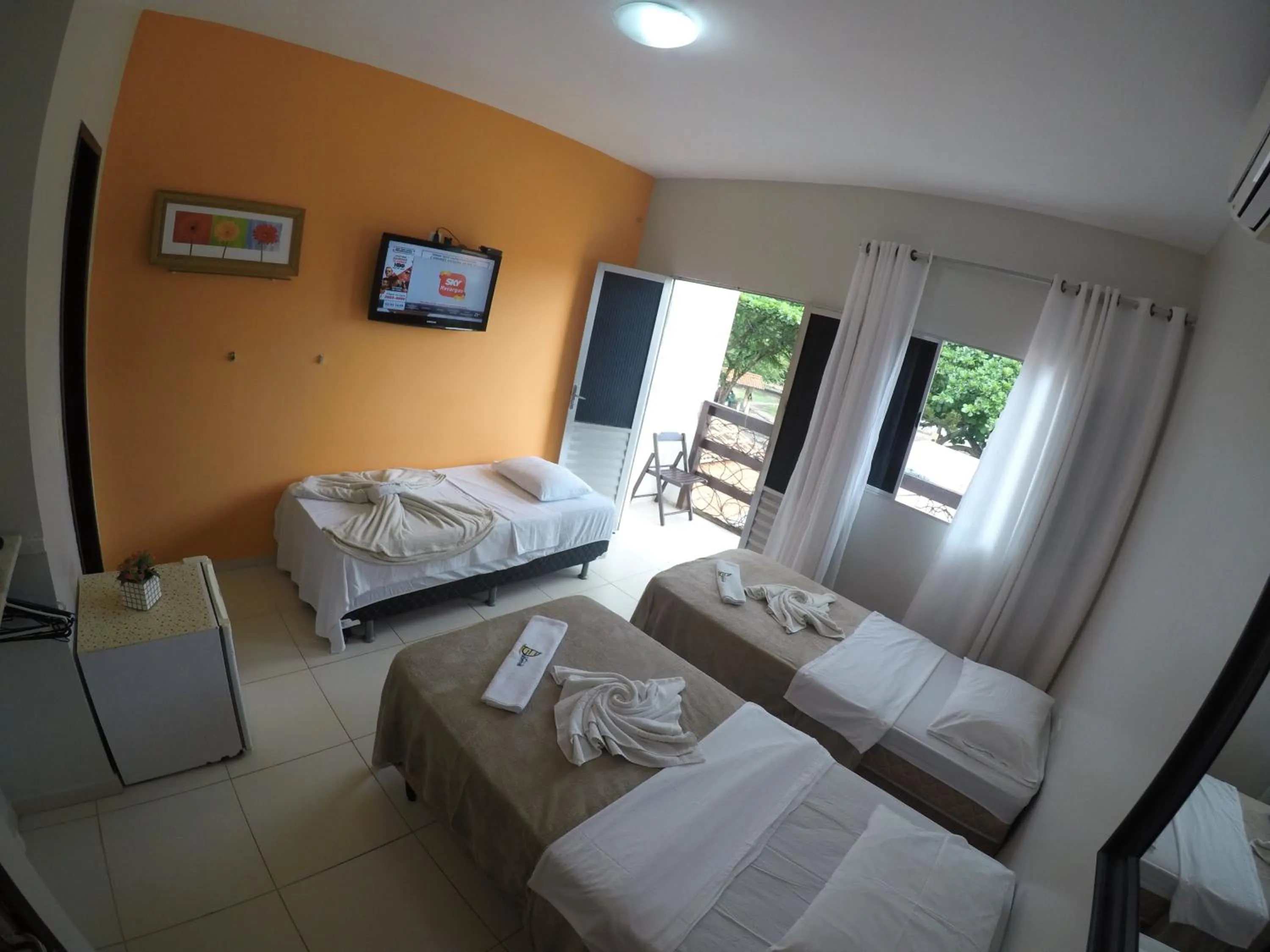 Bed in Pousada Velosmar