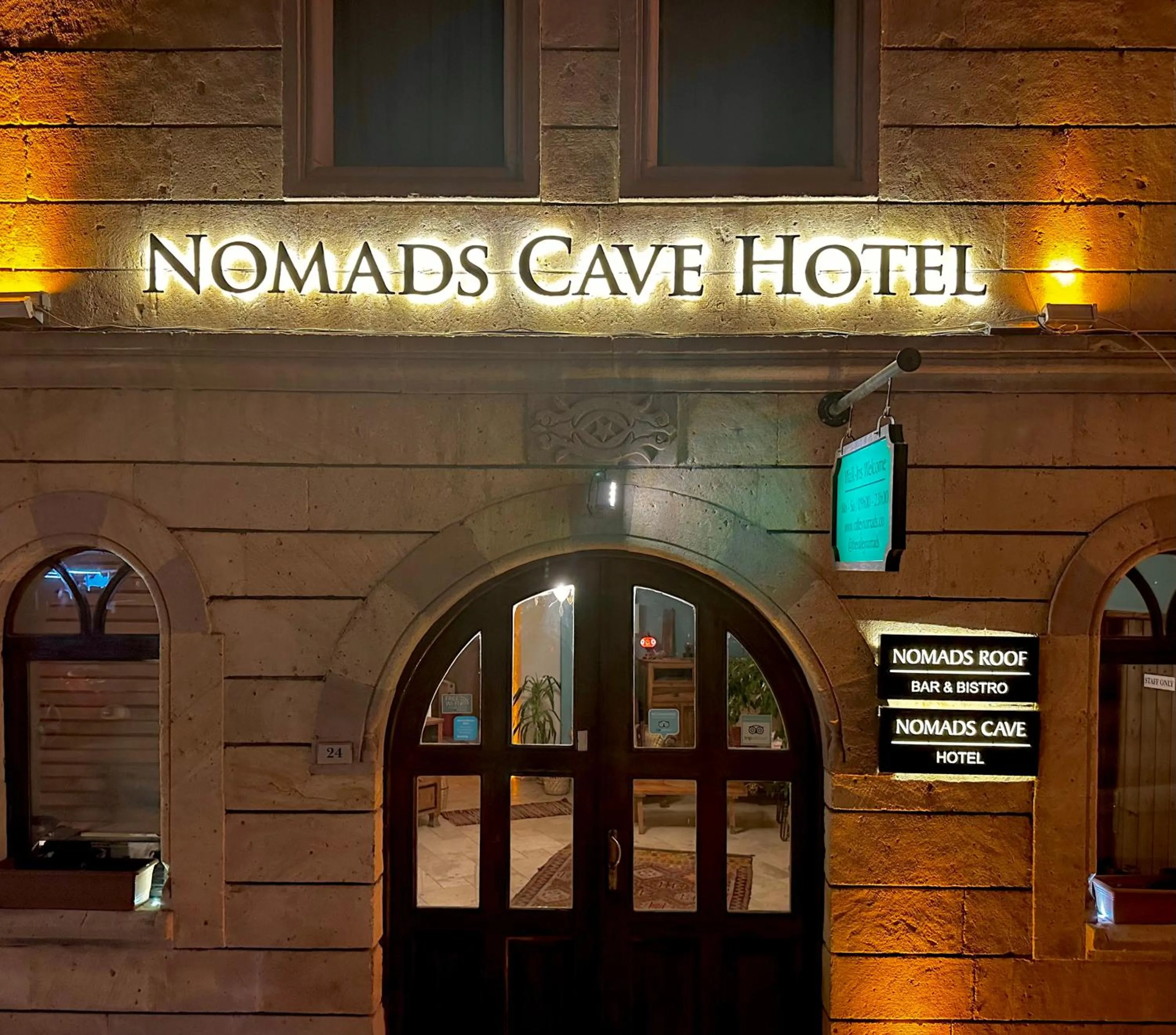 Property logo or sign in Nomads Cave Hotel & Rooftop