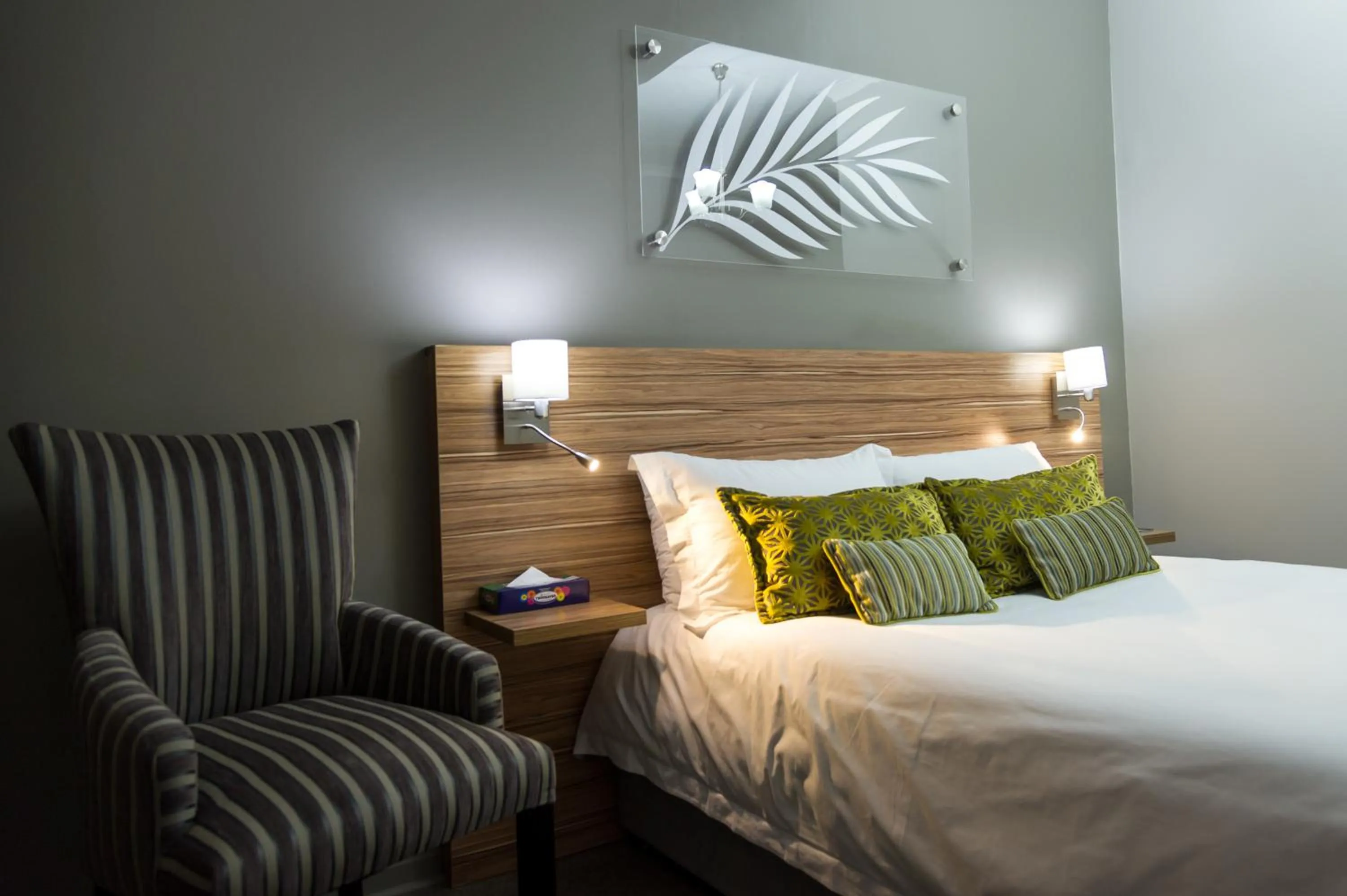 Seating area, Bed in Palm Lodge Guest House