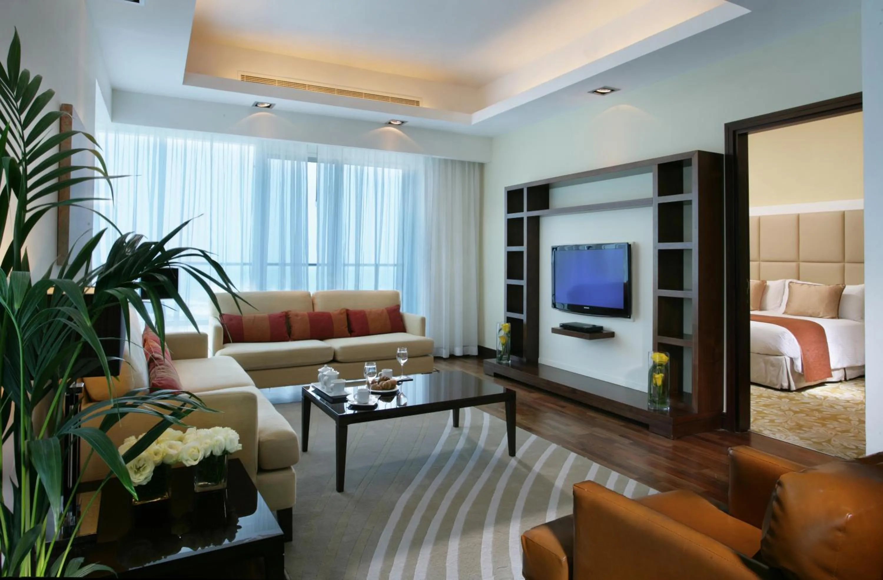 Living room, Bed in La Suite Dubai Hotel & Apartments
