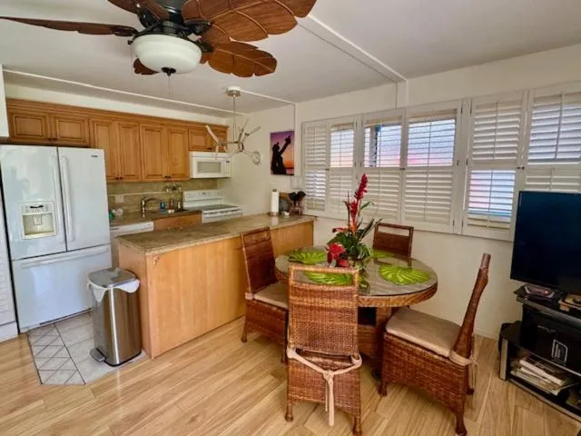 Kitchen or kitchenette in Kihei Kai Nani with a ocean view