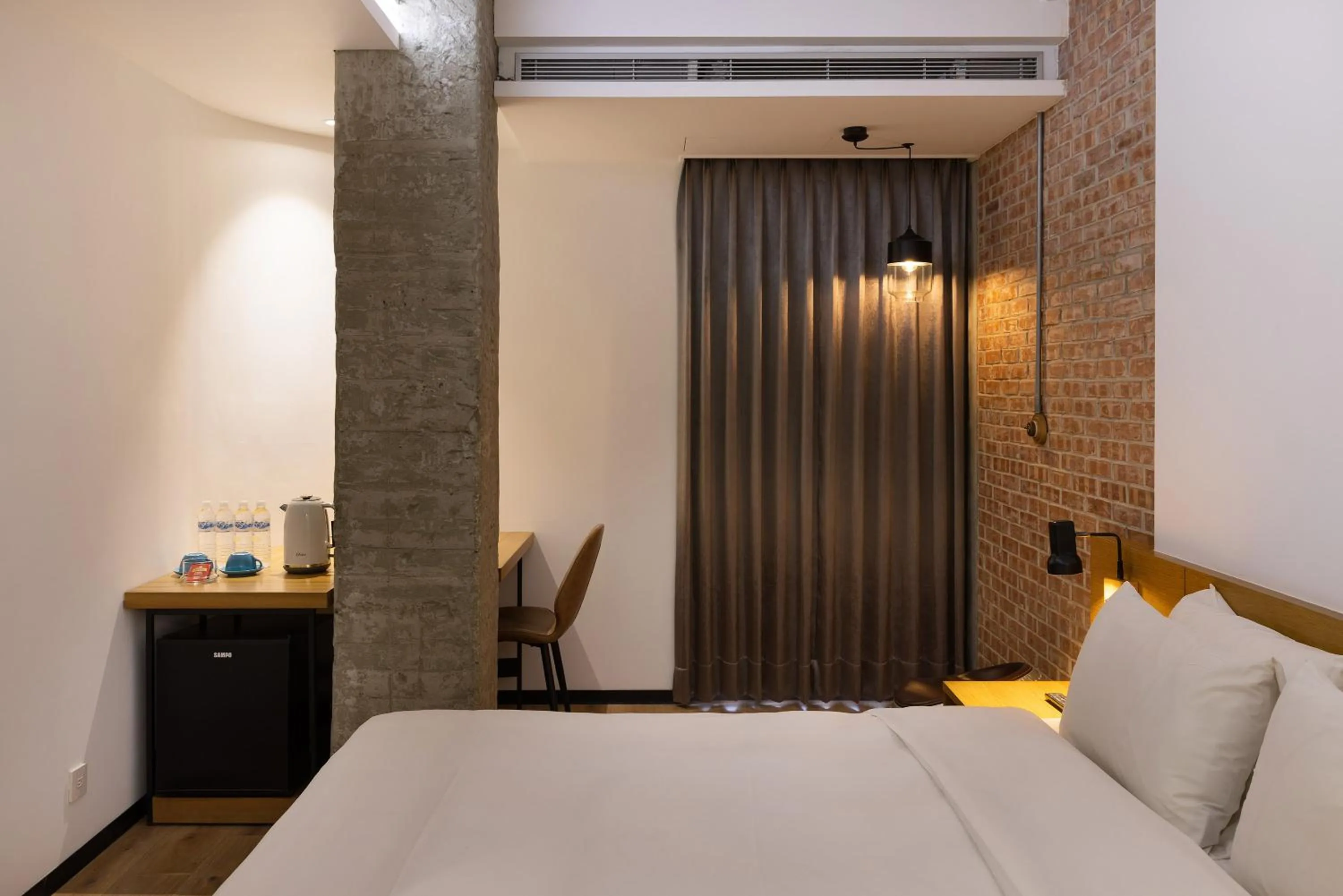 Bed in BlueSky Hotel