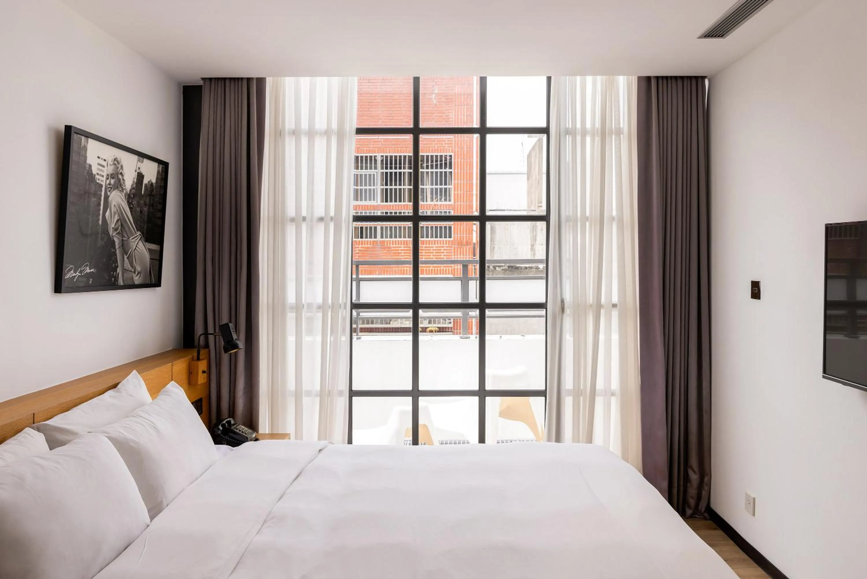 Bed in BlueSky Hotel