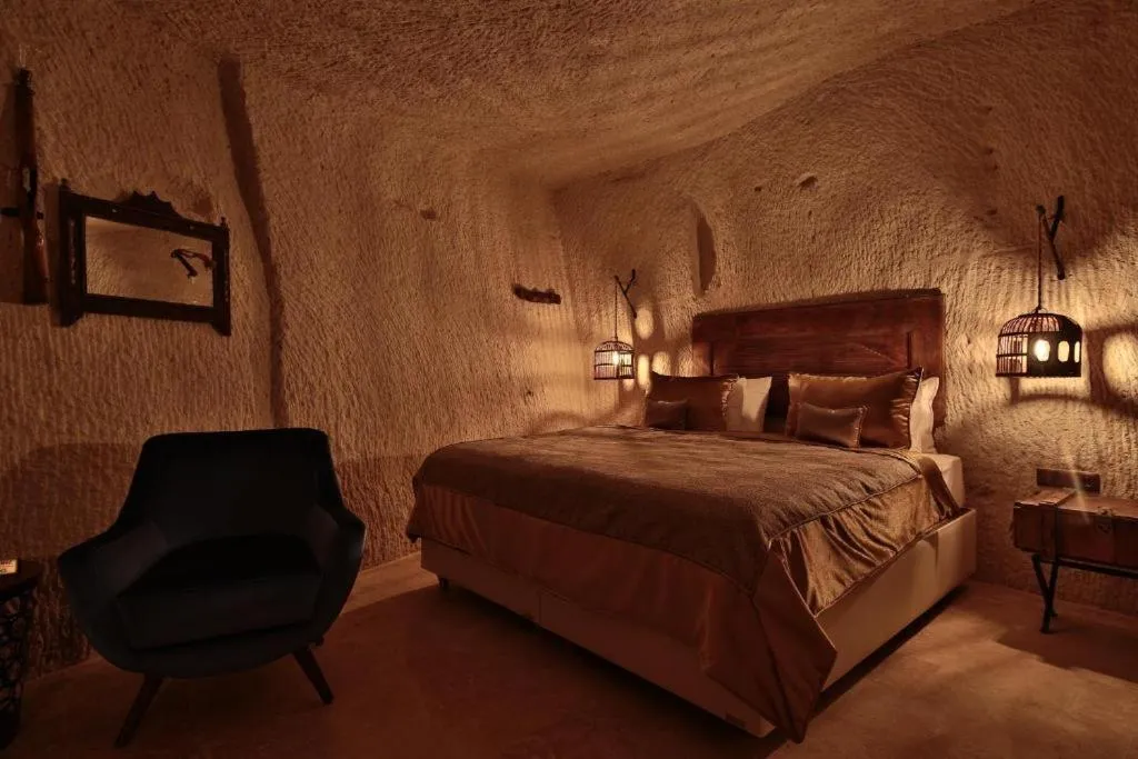 Bed in The Owl Cave Hotel