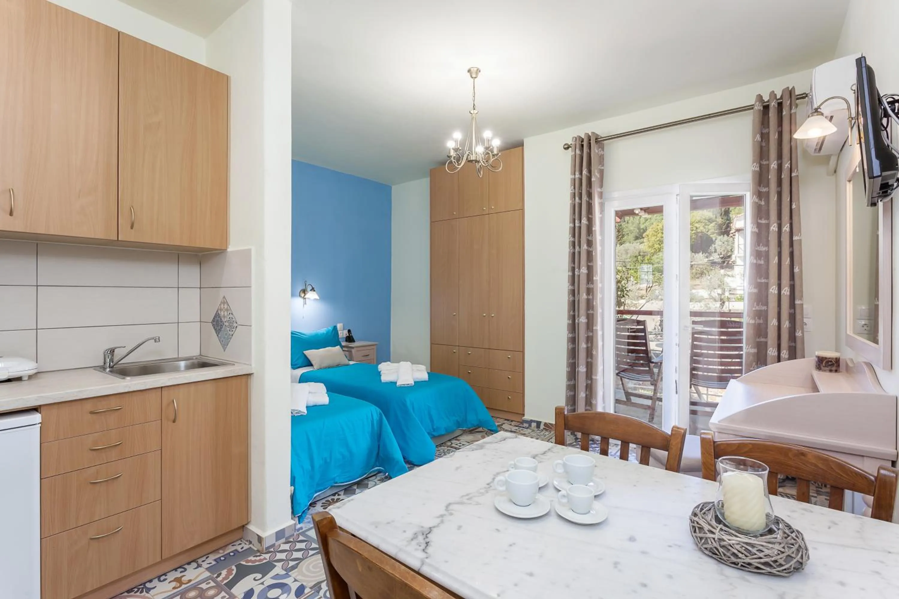 Seating area, Bed in Stafylos Suites & Boutique hotel