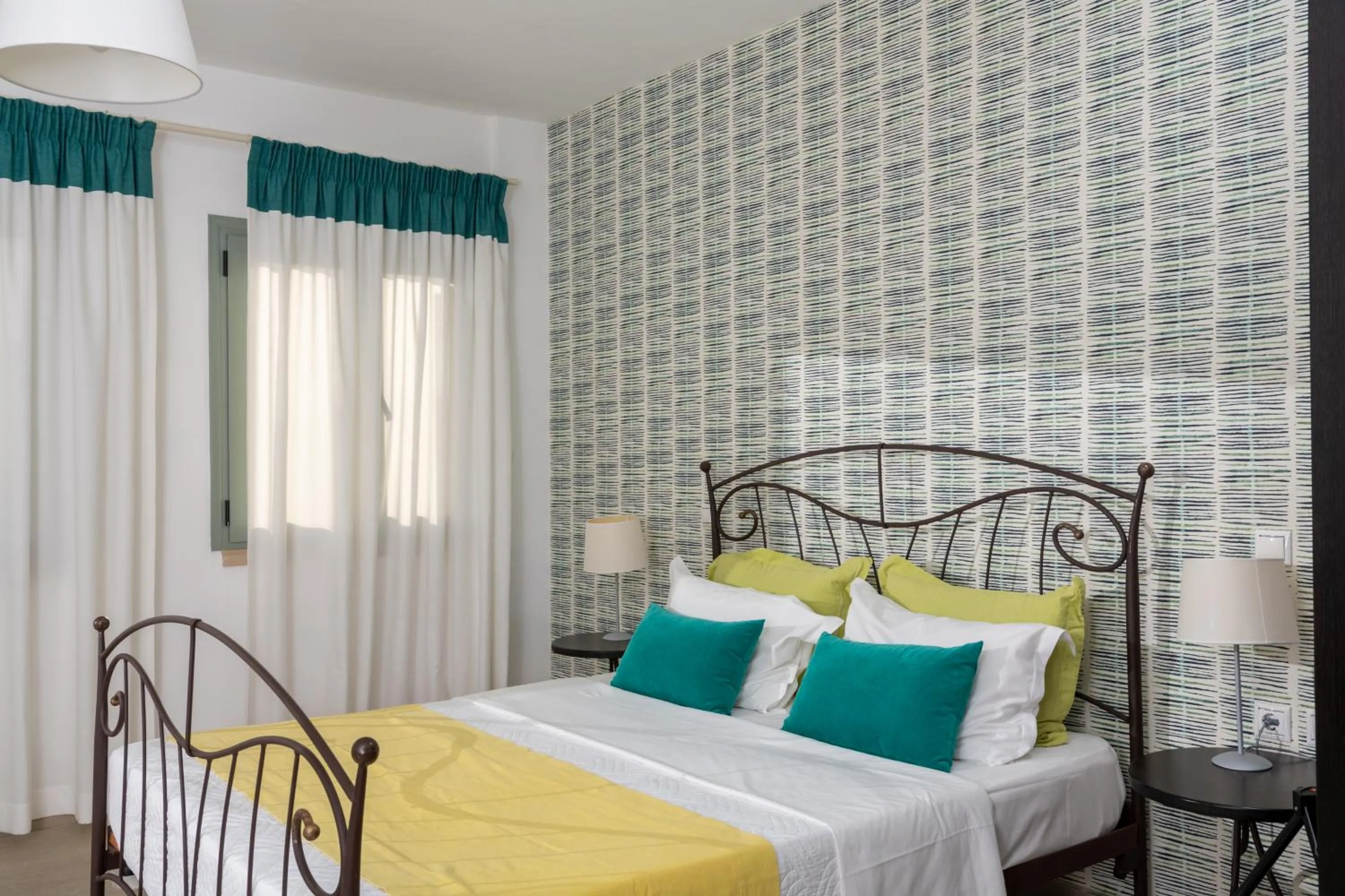 Bed in Angela Studios Apartments