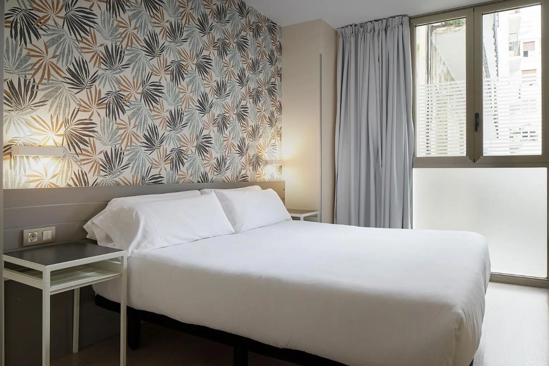 Bed in Welcome Gros Hotel