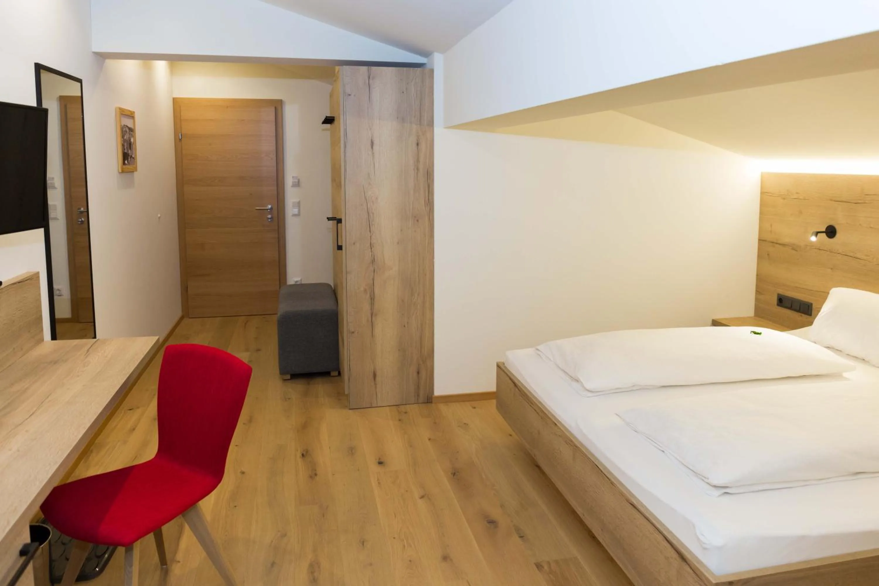 Living room, Bed in Hotel Rosner