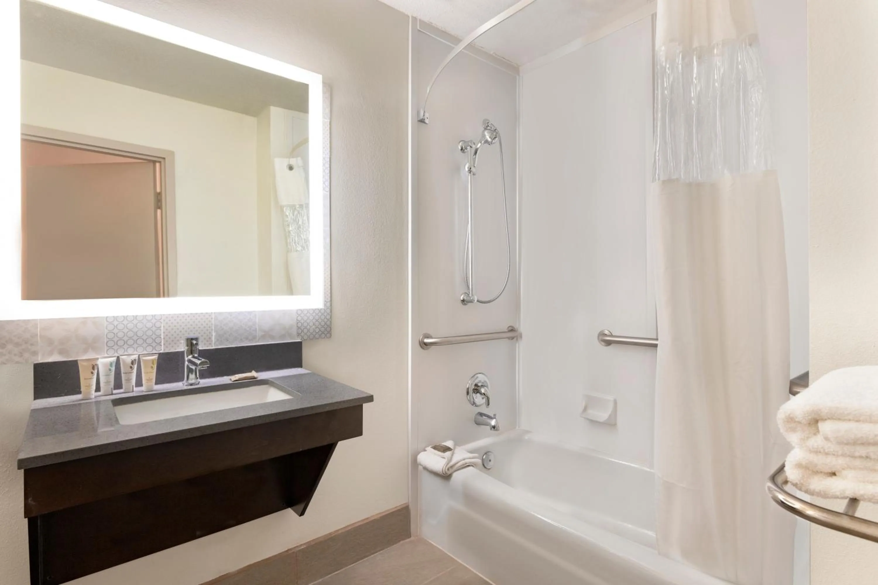 Bathroom in Country Inn & Suites by Radisson, North Little Rock, AR