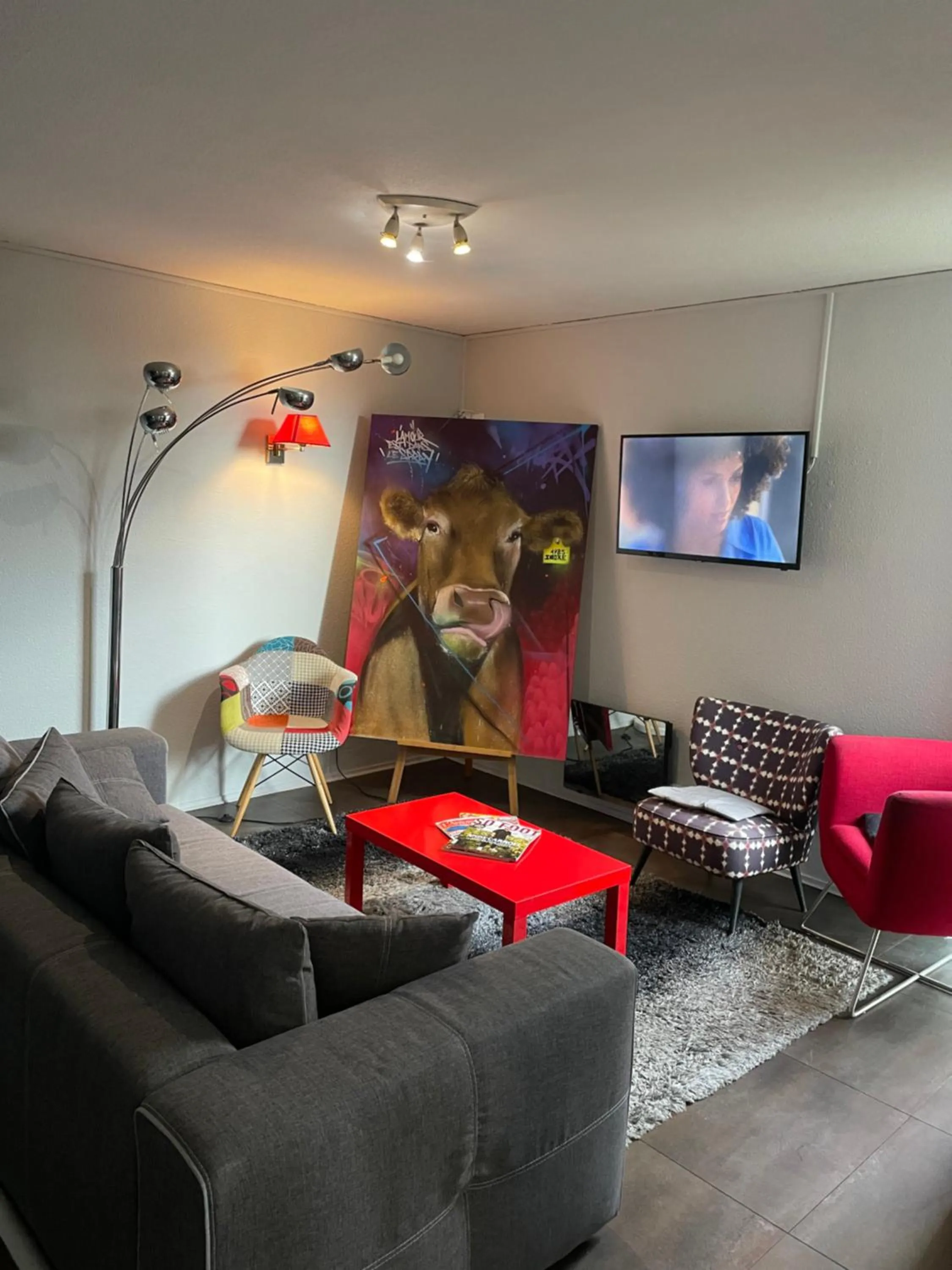 Communal lounge/ TV room in Hotel Restaurant Kyriad Brive Centre