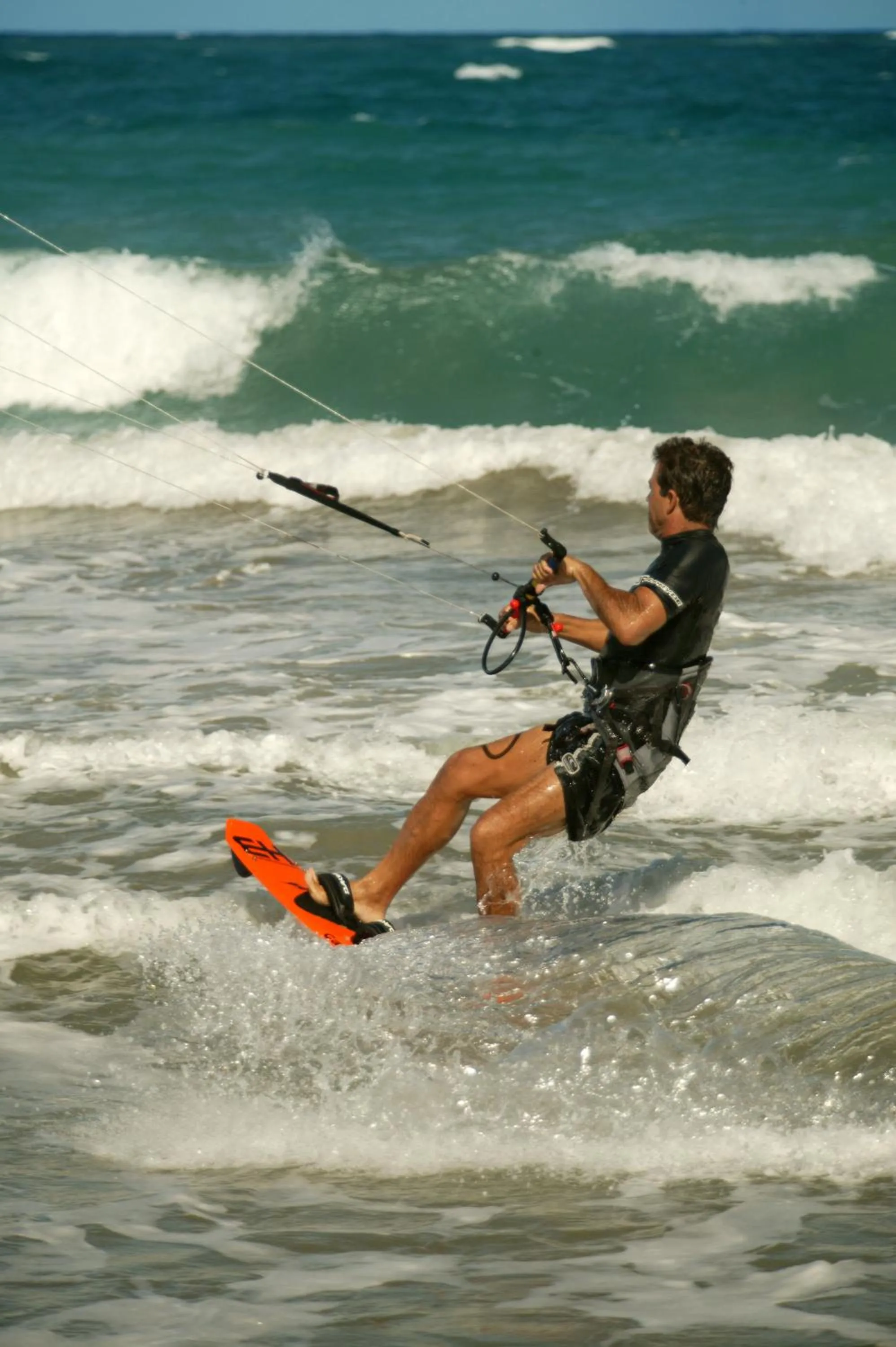 Windsurfing in Viva Tangerine by Wyndham, A Trademark All Inclusive