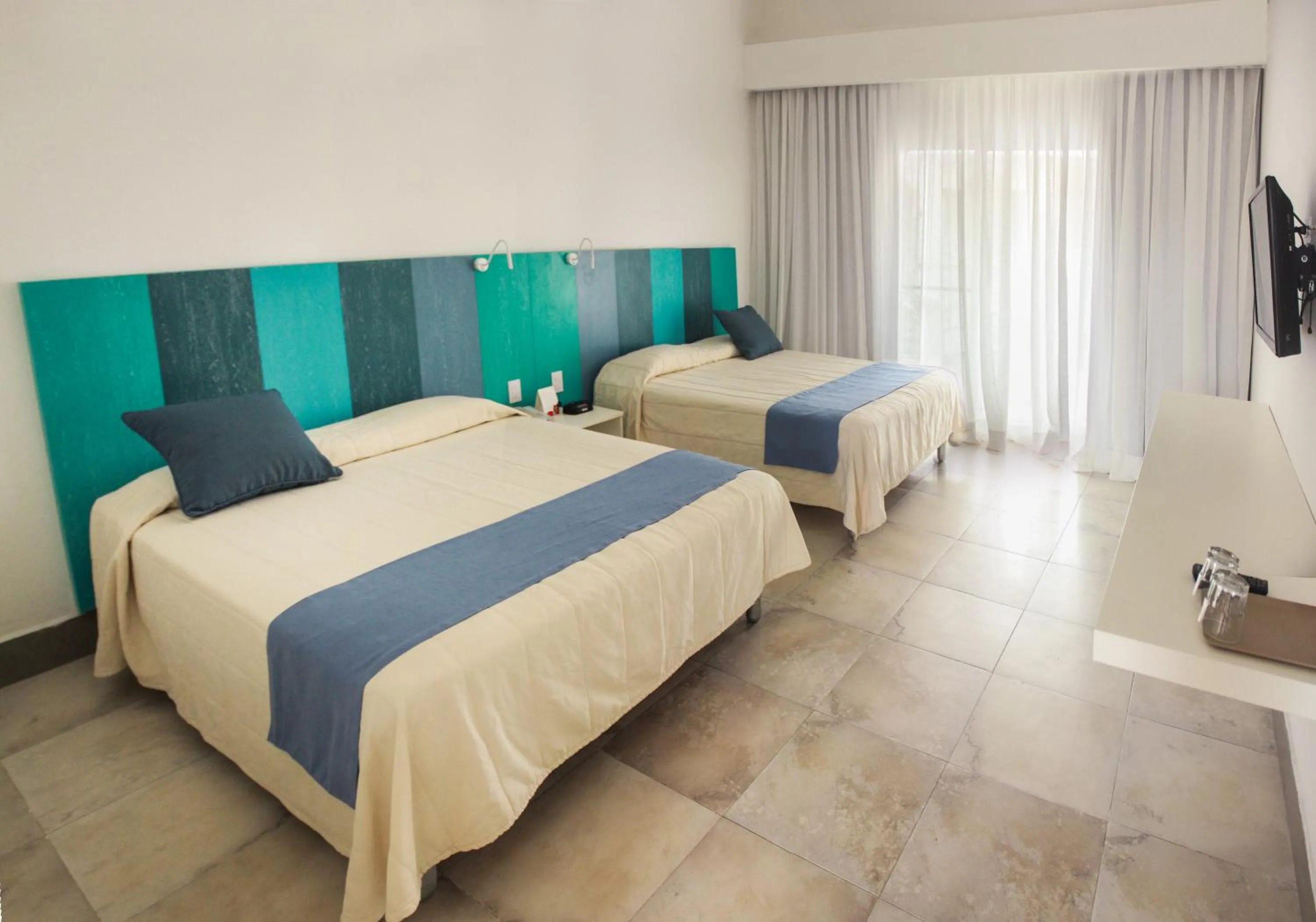 Photo of the whole room, Bed in Viva Tangerine by Wyndham, A Trademark All Inclusive