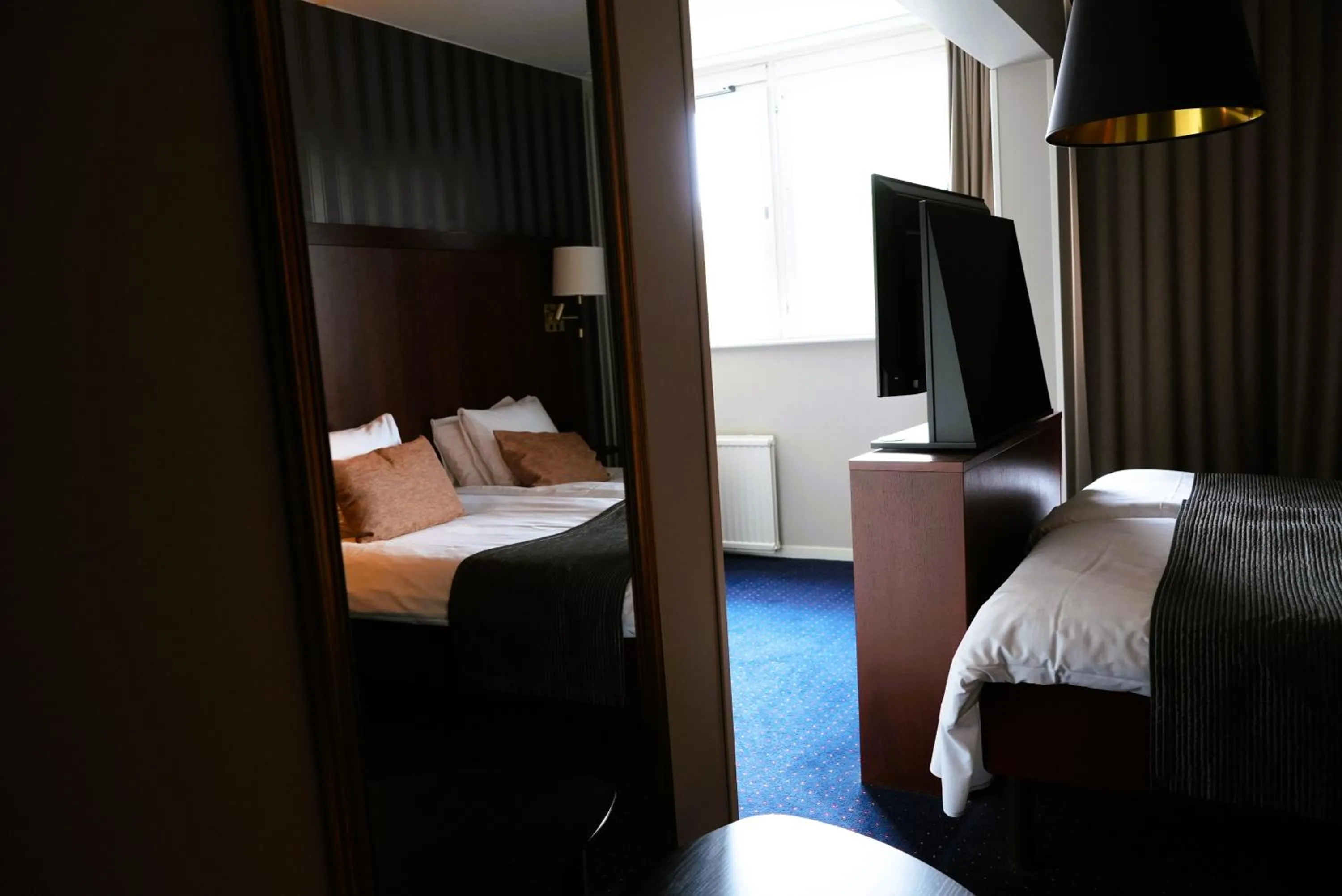 Bed in Vänerport Stadshotell i Mariestad