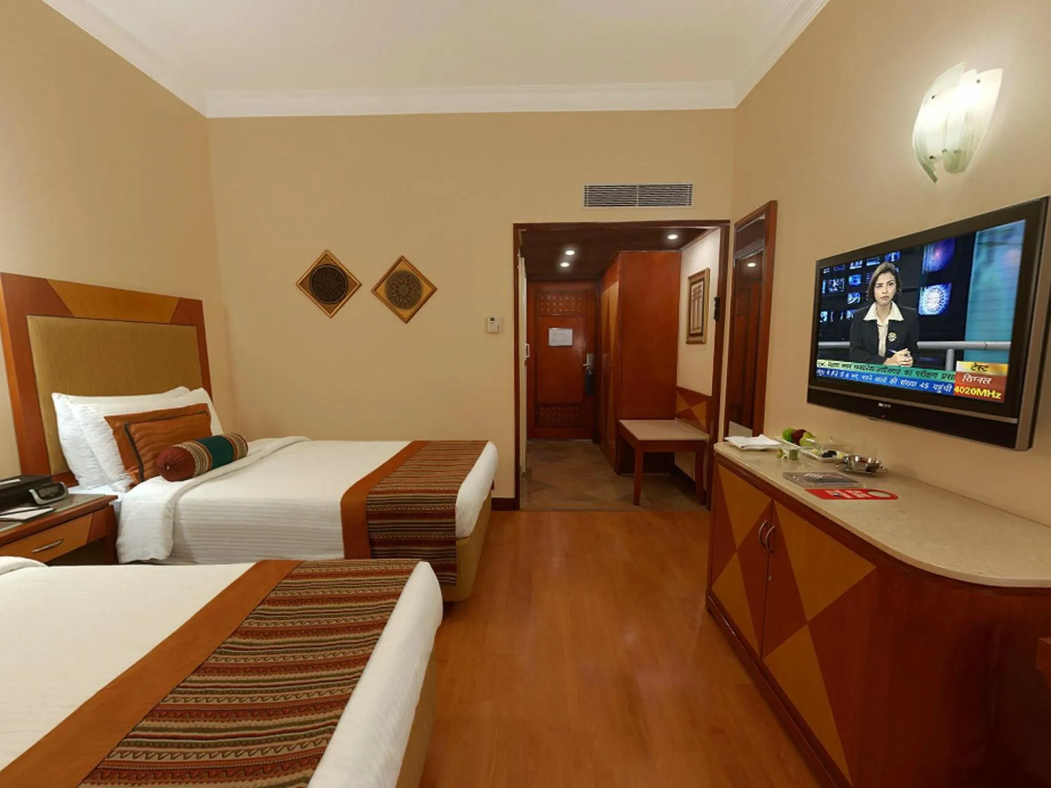 Bed in The Lalit Ashok