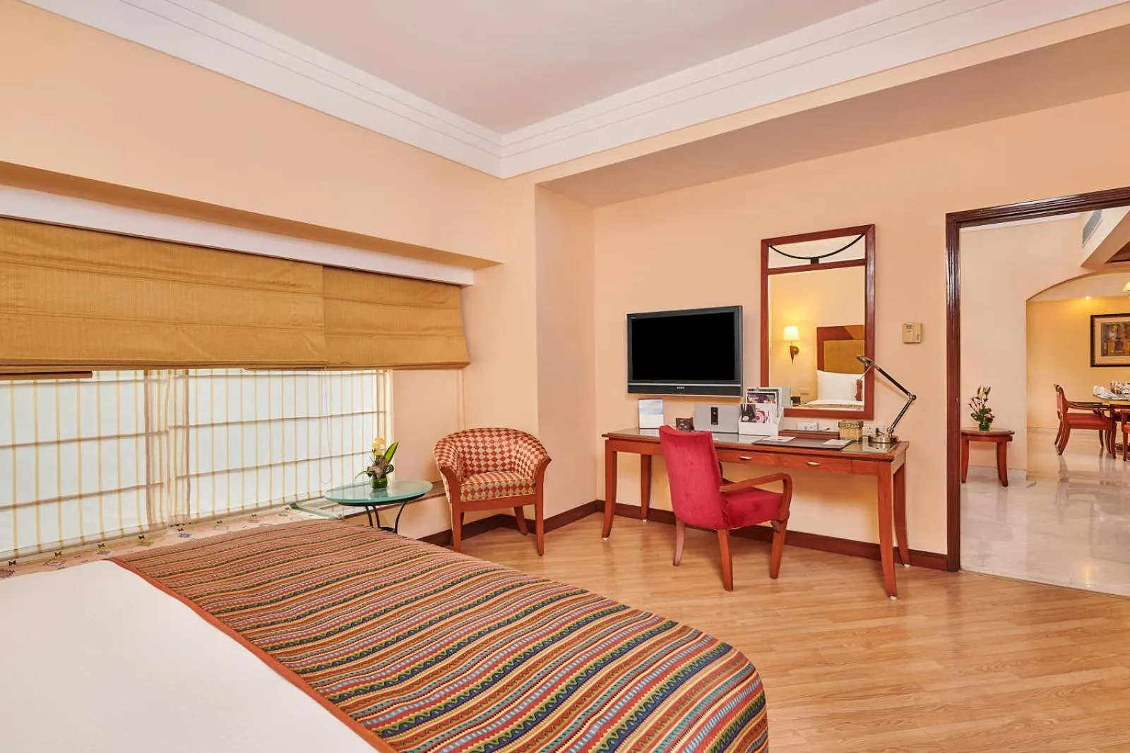 Photo of the whole room, Bed in The Lalit Ashok