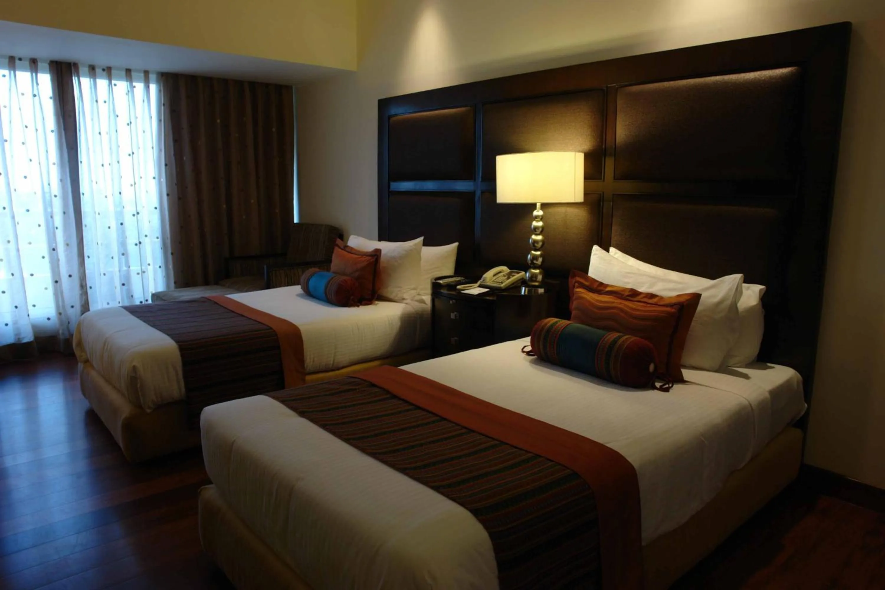 Bed in The Lalit Ashok