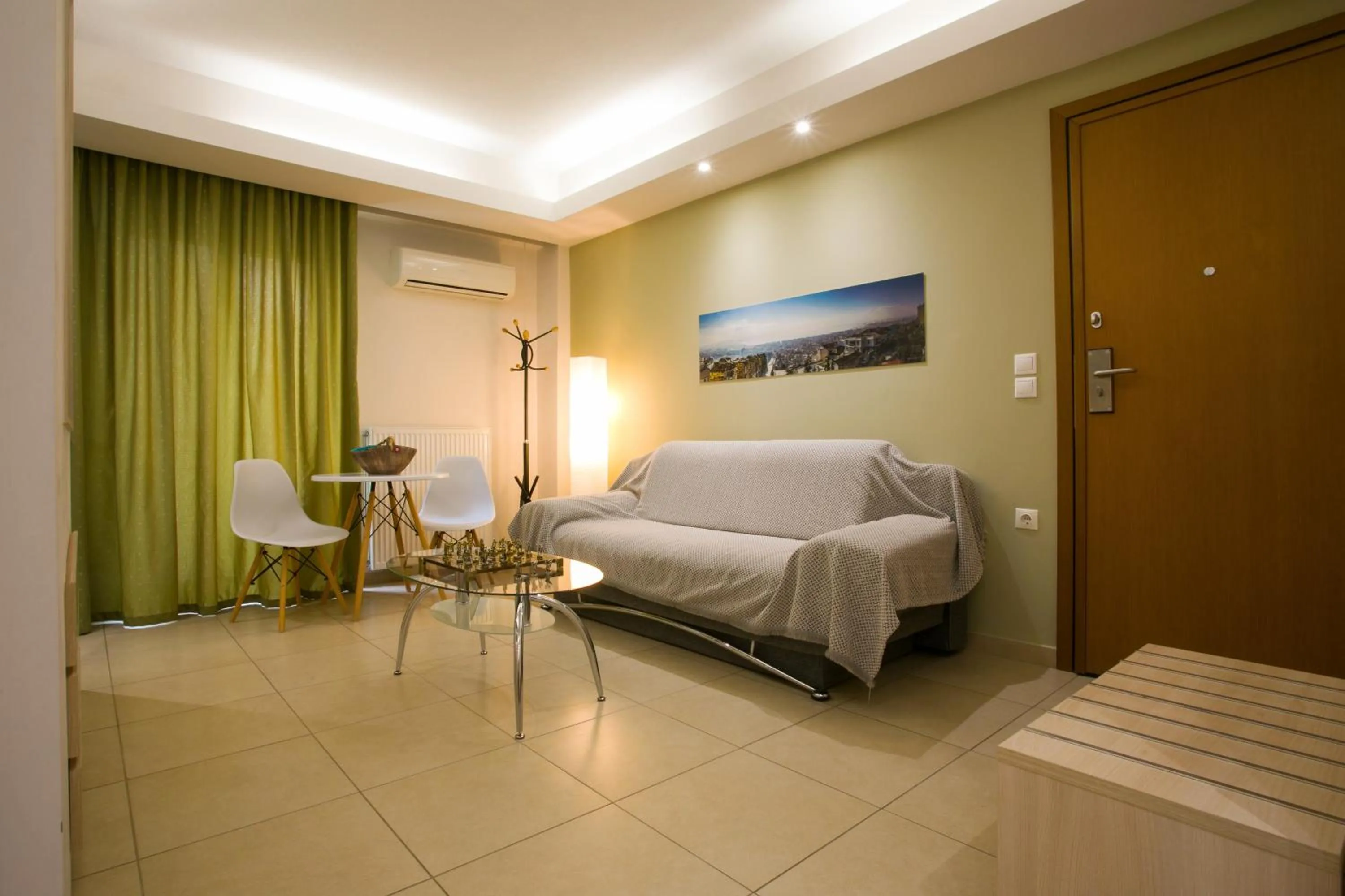 Seating area, Bed in Polis Apartments