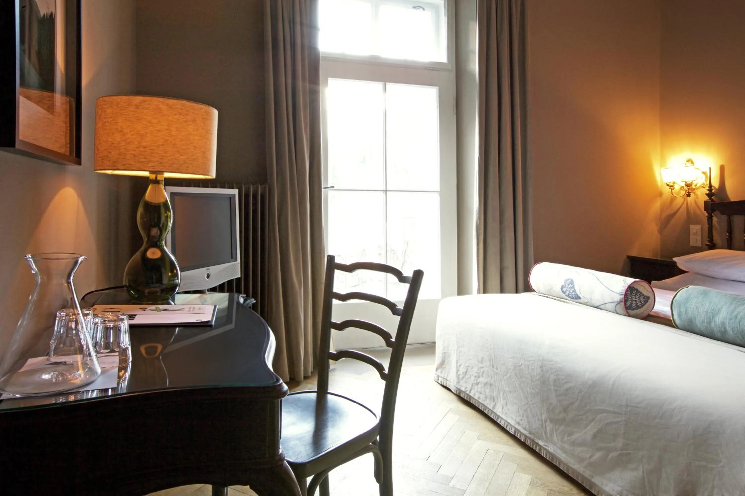 Bed in Das REGINA Boutiquehotel