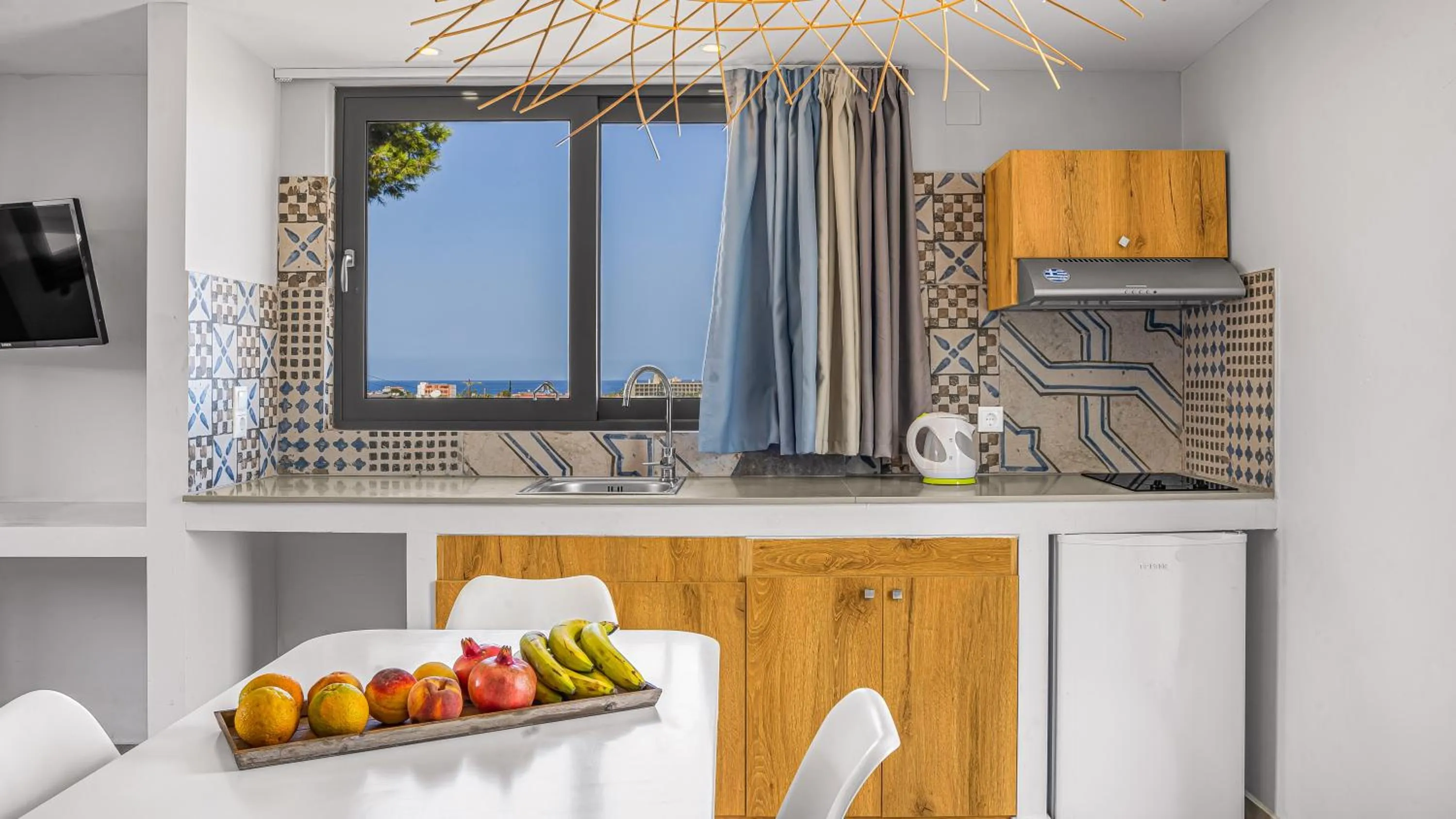 kitchen in Natali Apartments by Estia