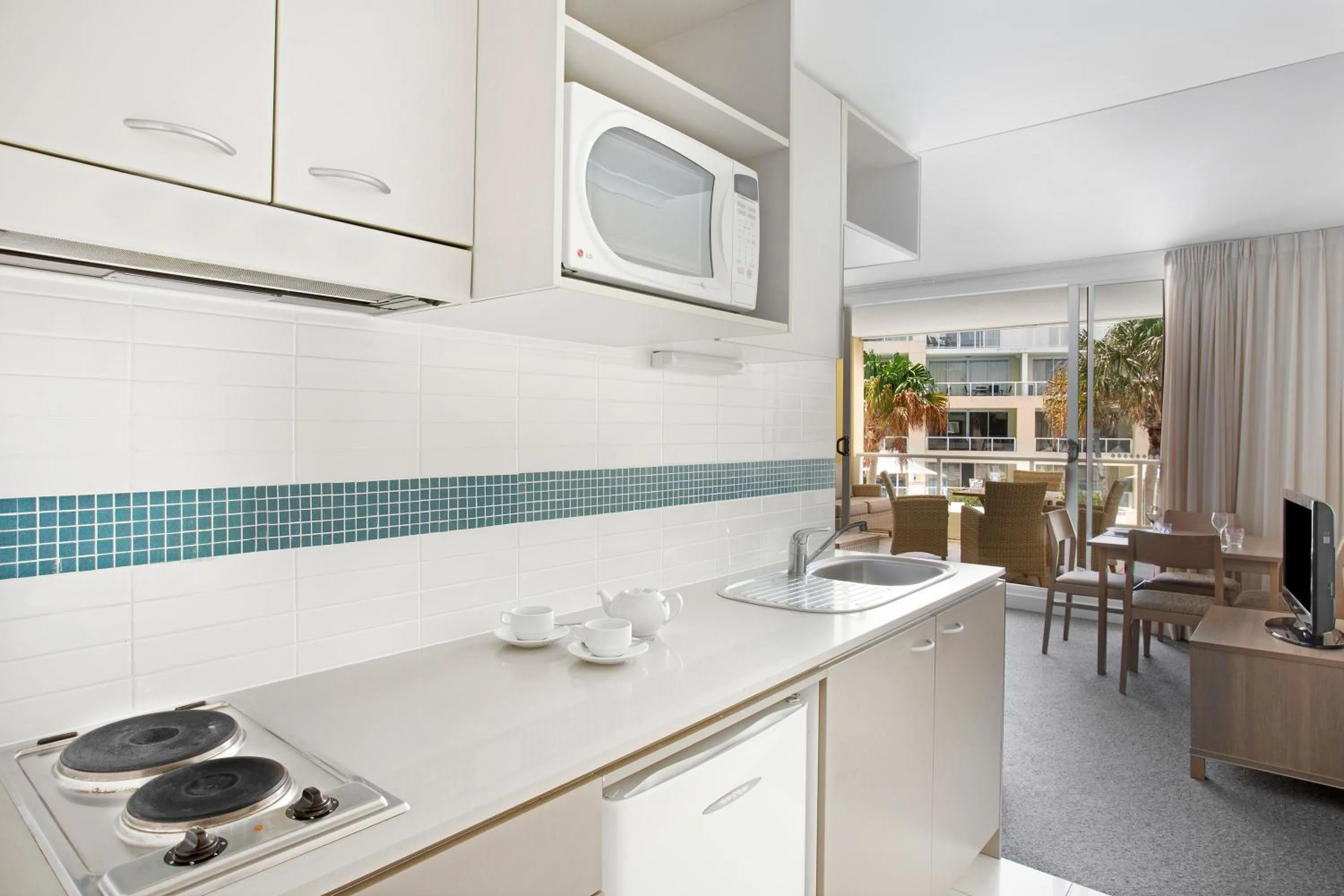 Kitchen or kitchenette in Mantra Ettalong Beach