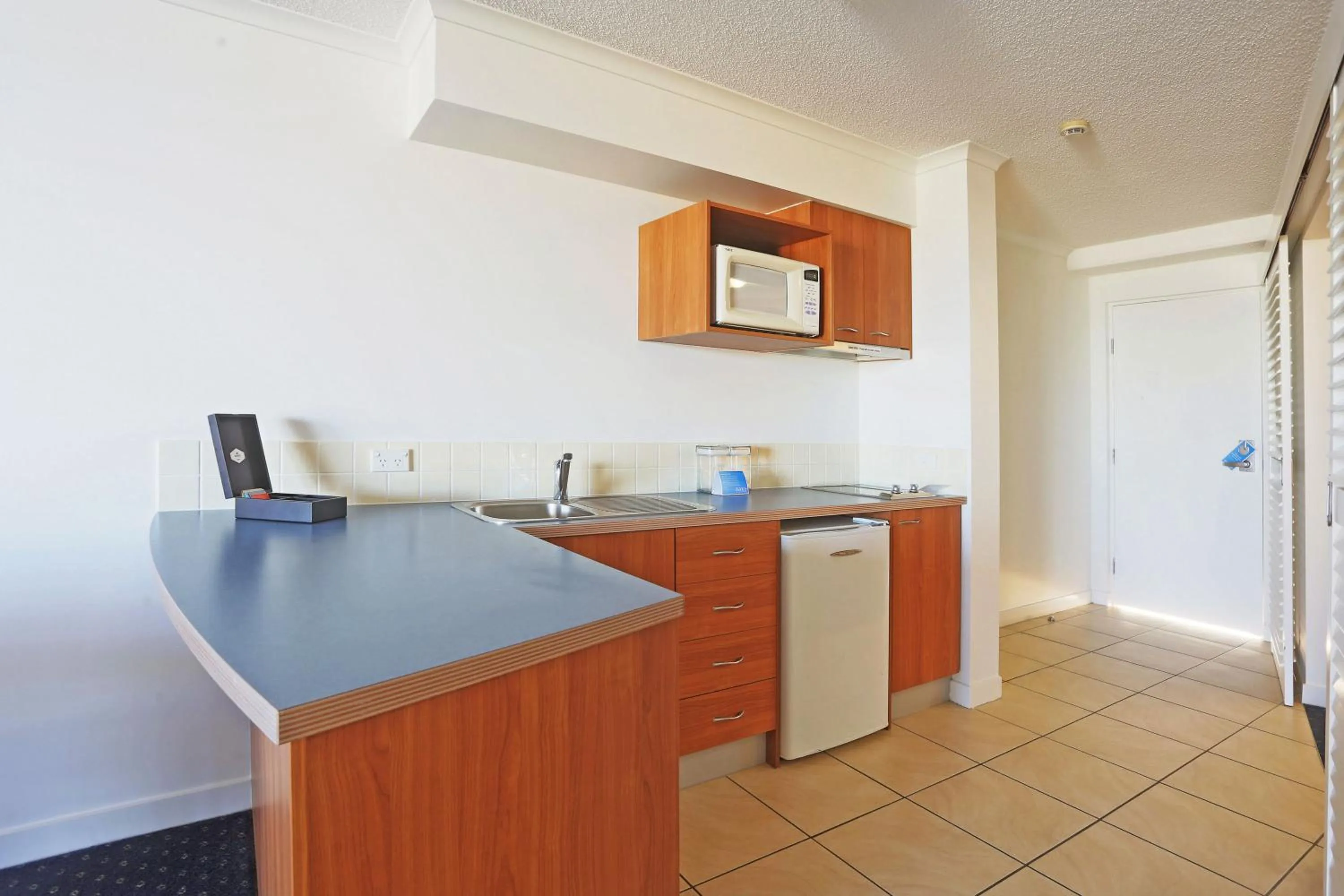 Kitchen or kitchenette in Mantra Hervey Bay