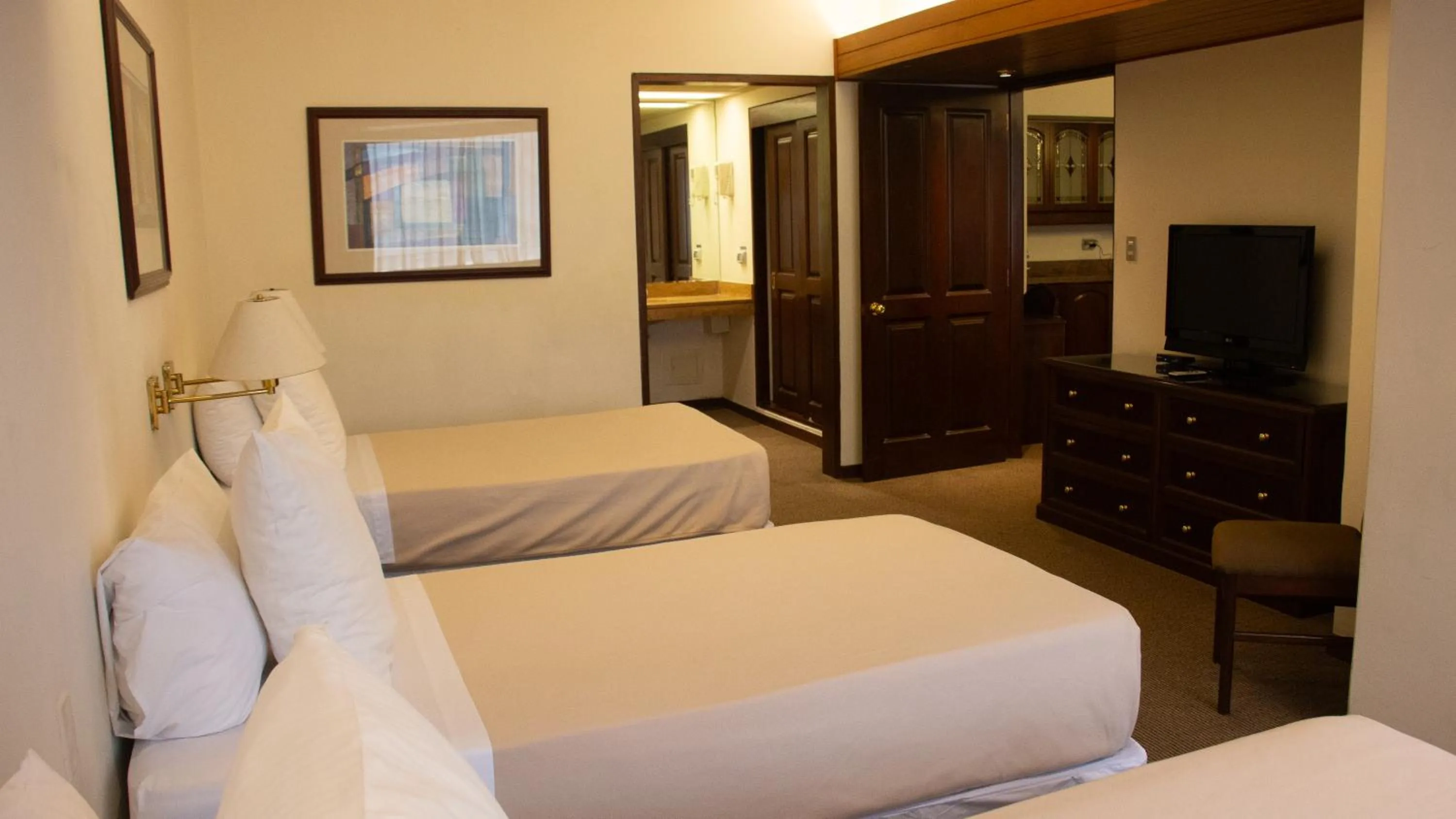 Bed in J&A Classic Hotel