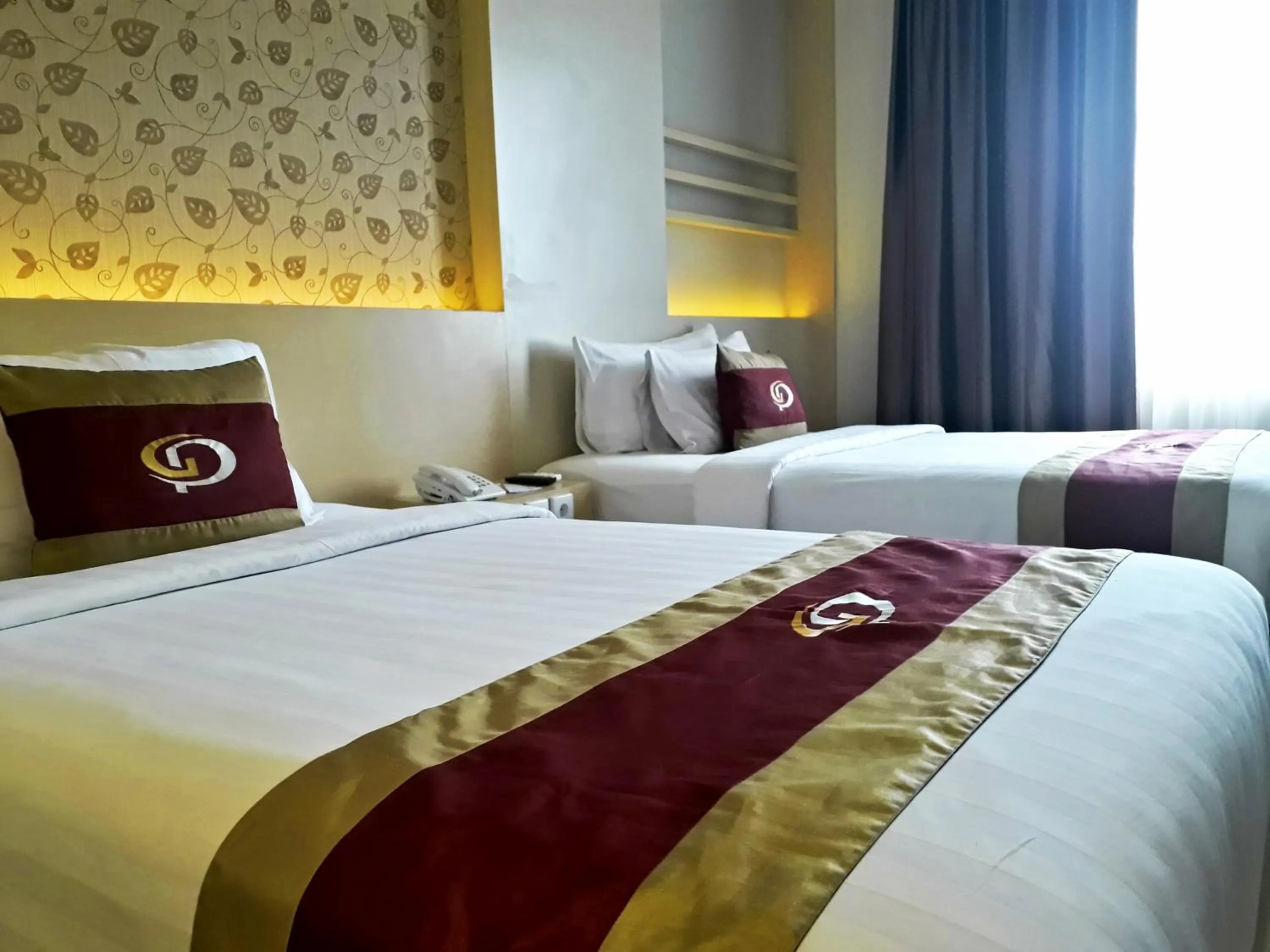 Bed in Grand Parama Hotel