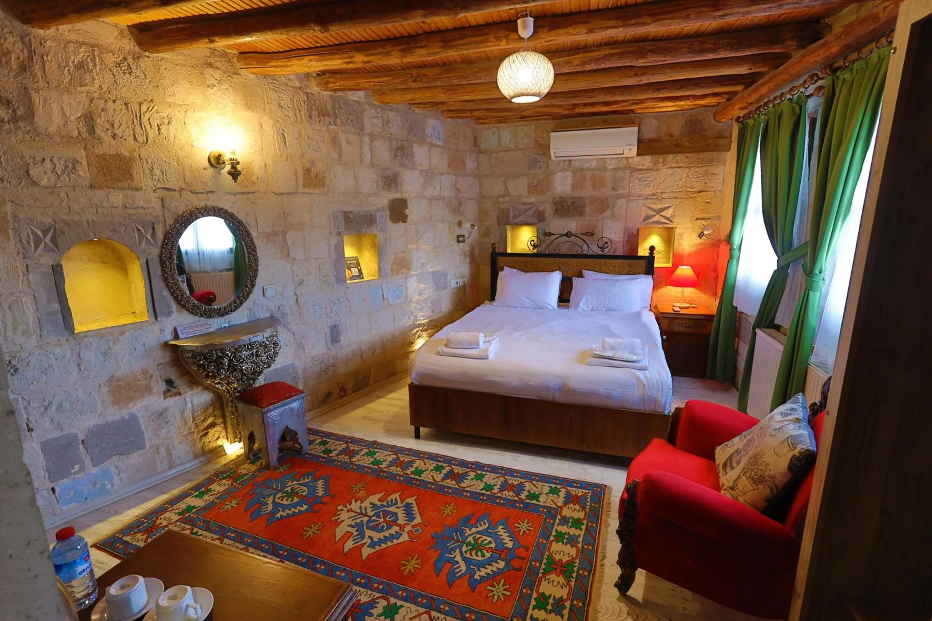 Bed in Bedrock Cave Hotel