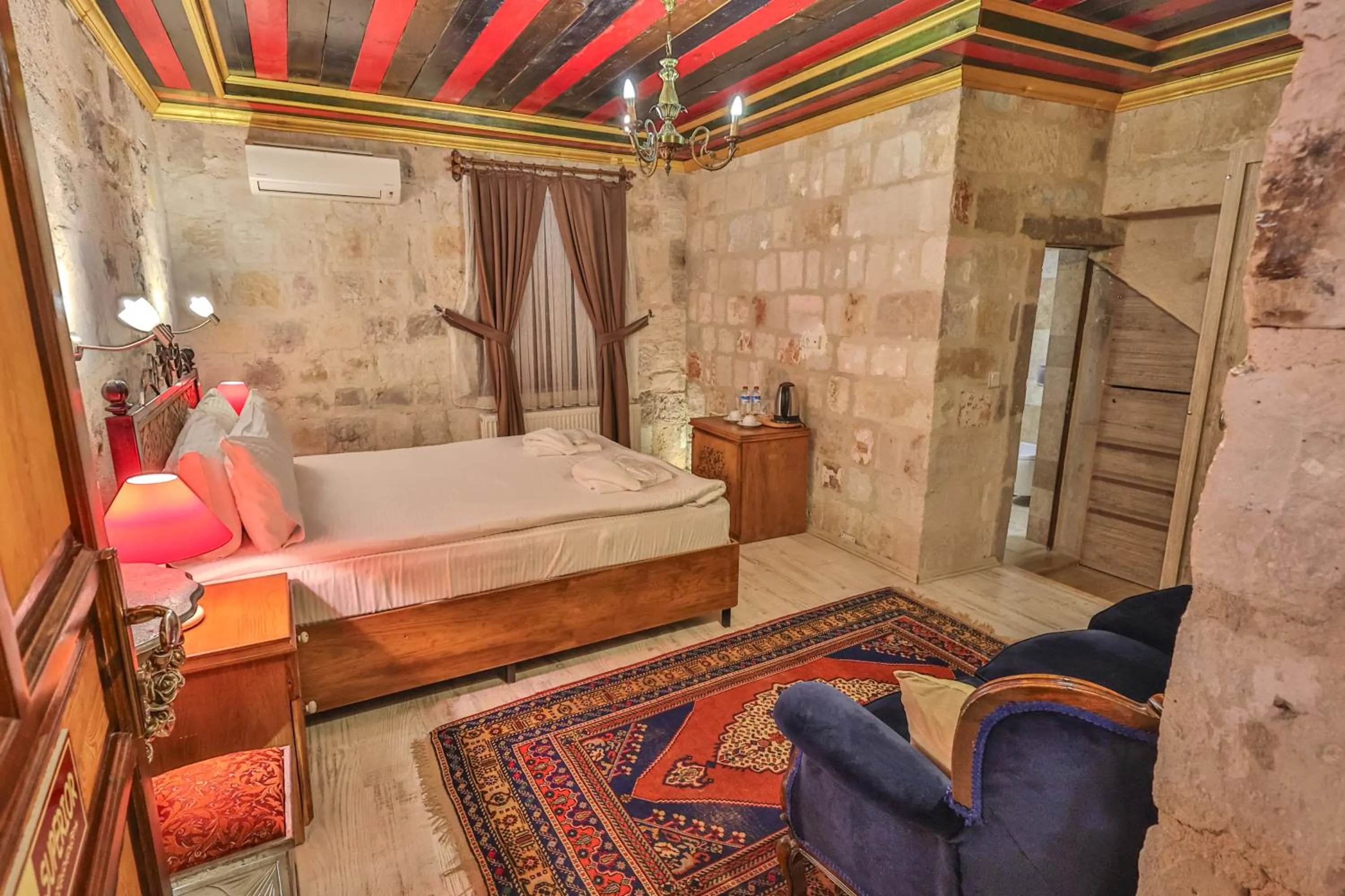 Bed in Bedrock Cave Hotel