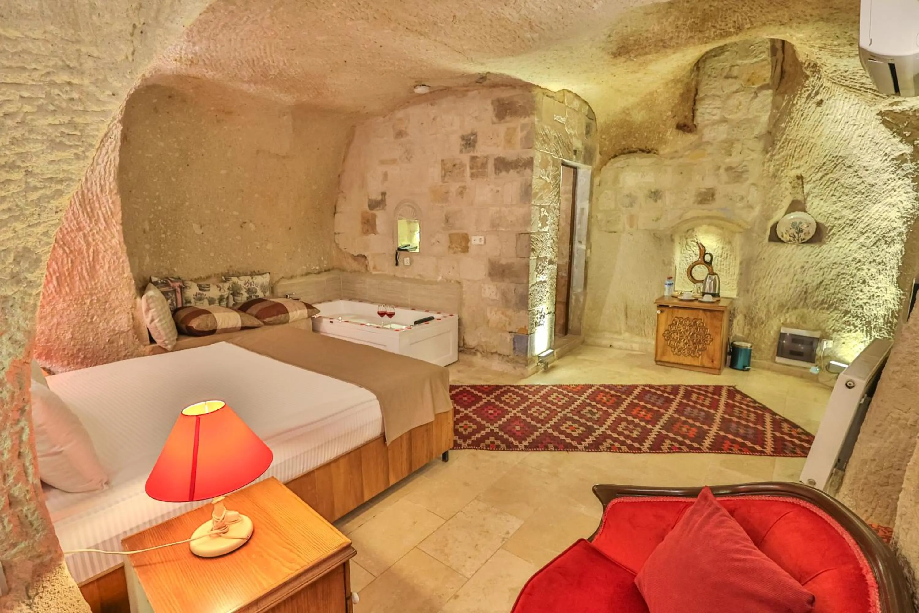 Bed in Bedrock Cave Hotel