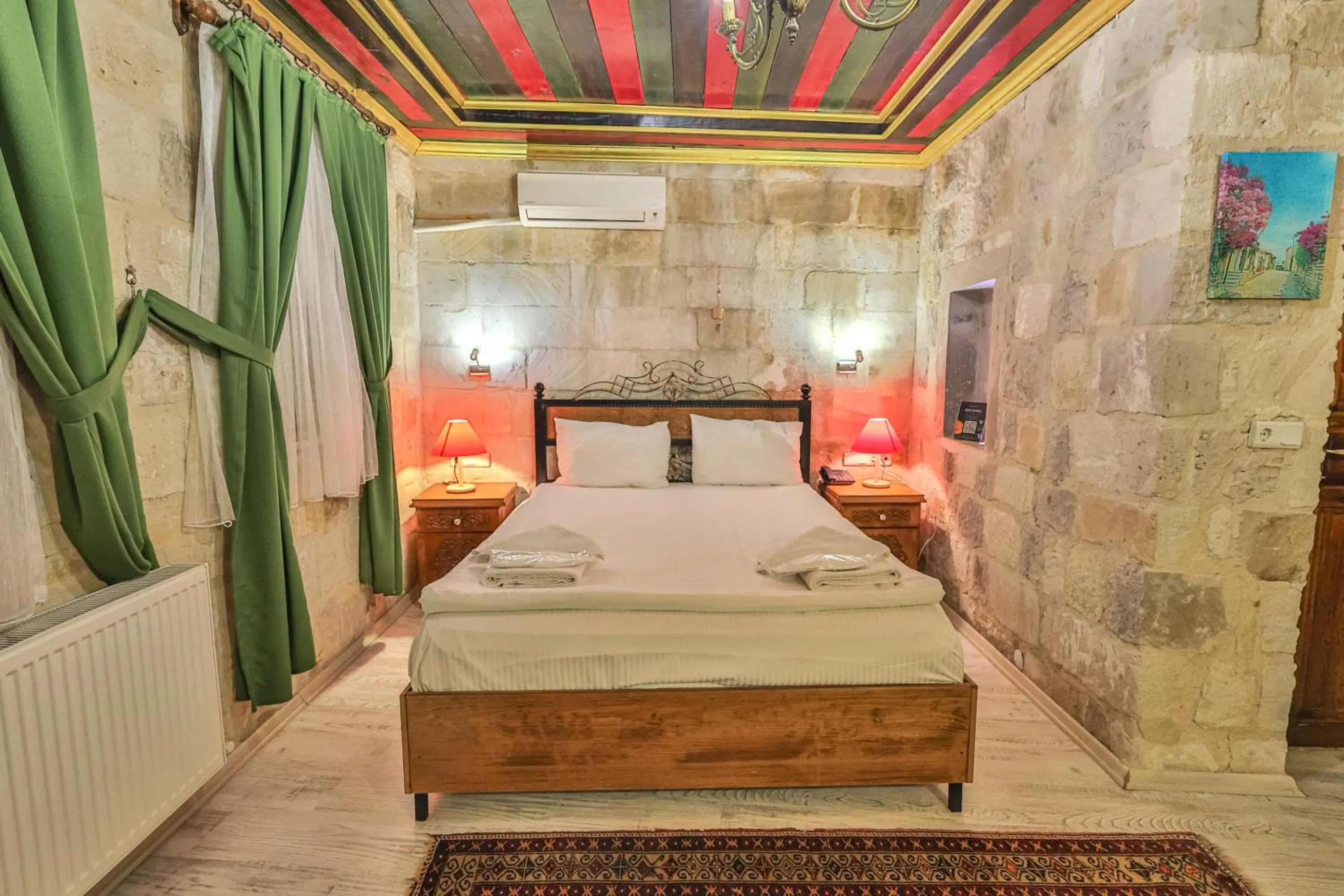 Bed in Bedrock Cave Hotel