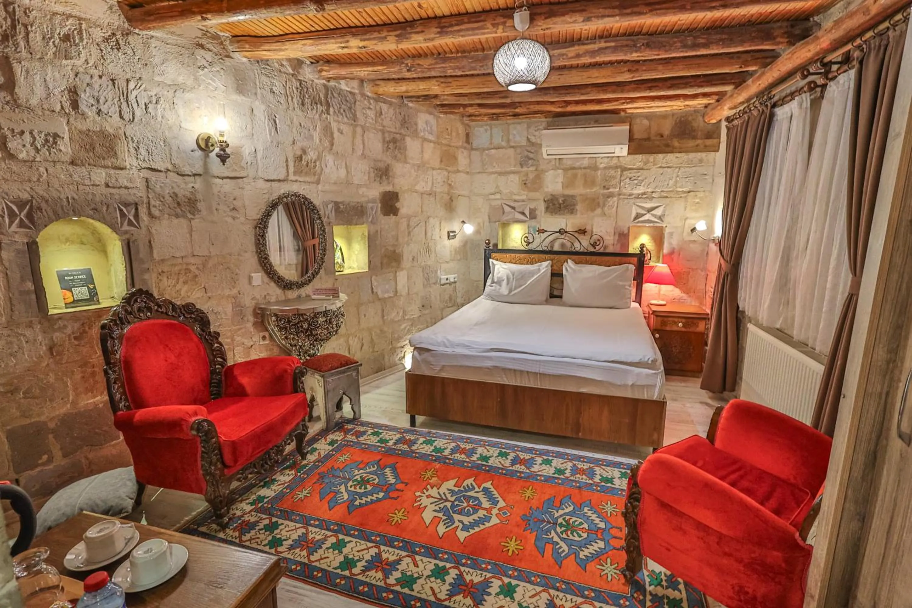 Bed in Bedrock Cave Hotel