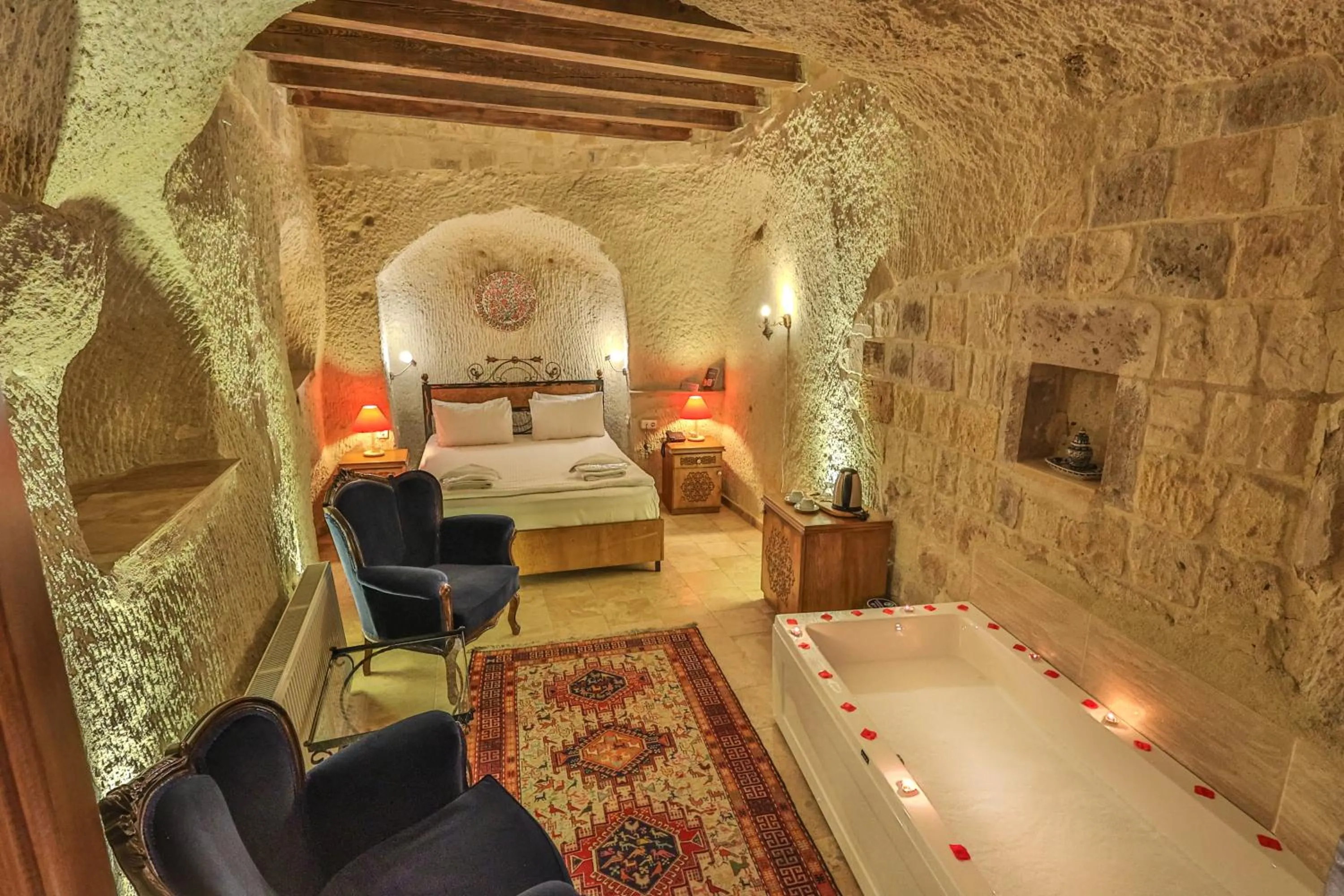 Bed in Bedrock Cave Hotel