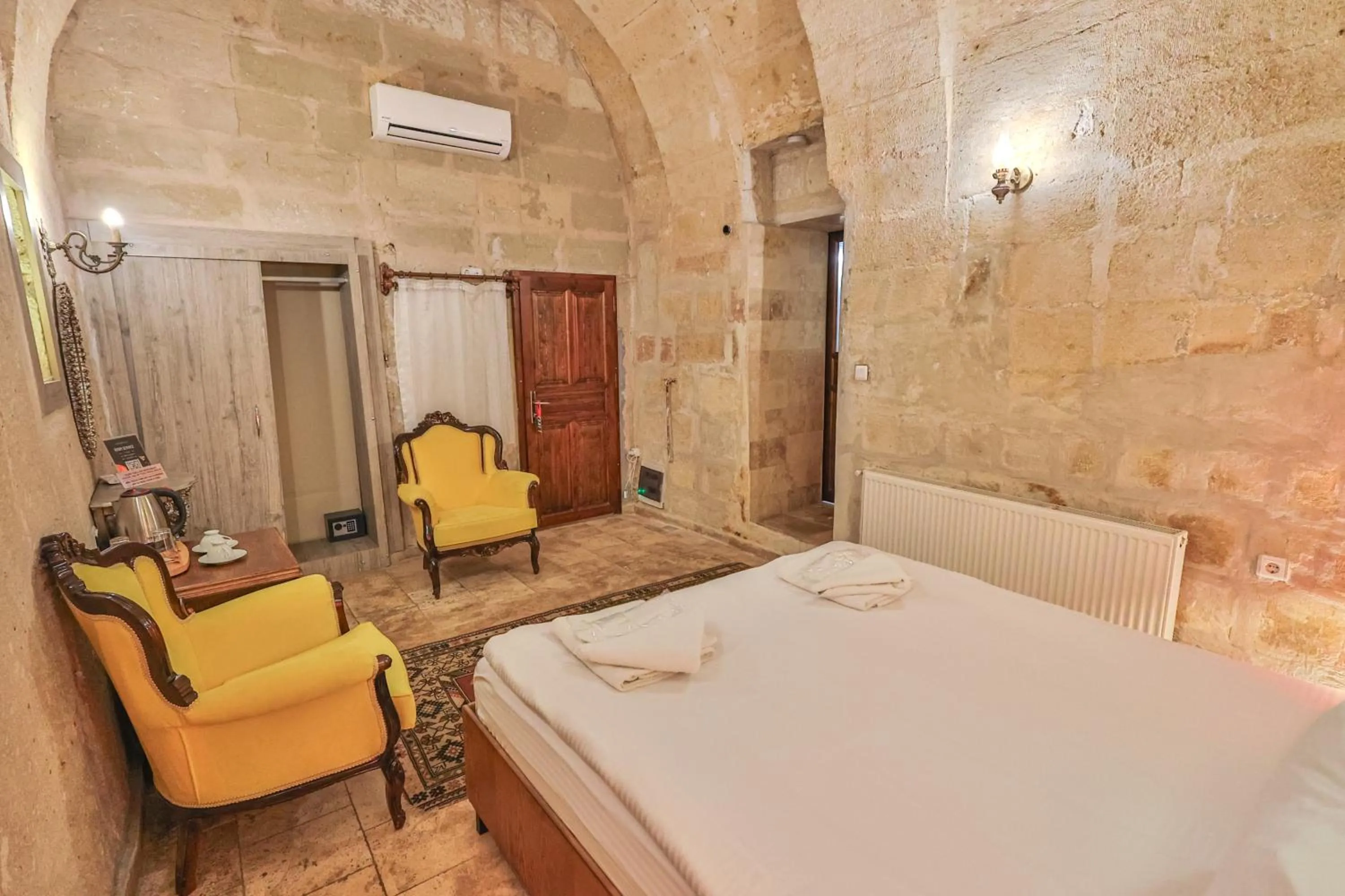 Bed in Bedrock Cave Hotel