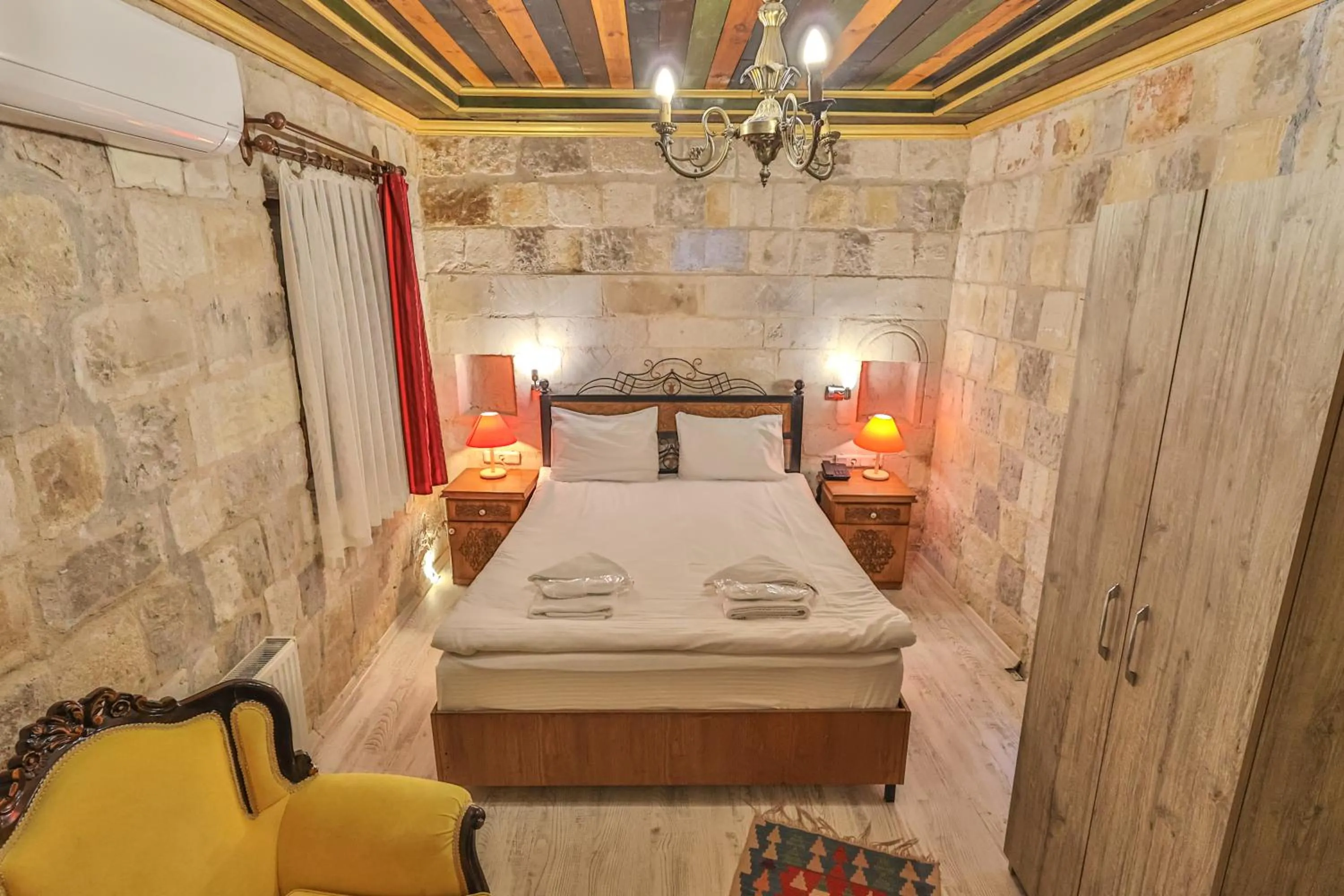 Bed in Bedrock Cave Hotel