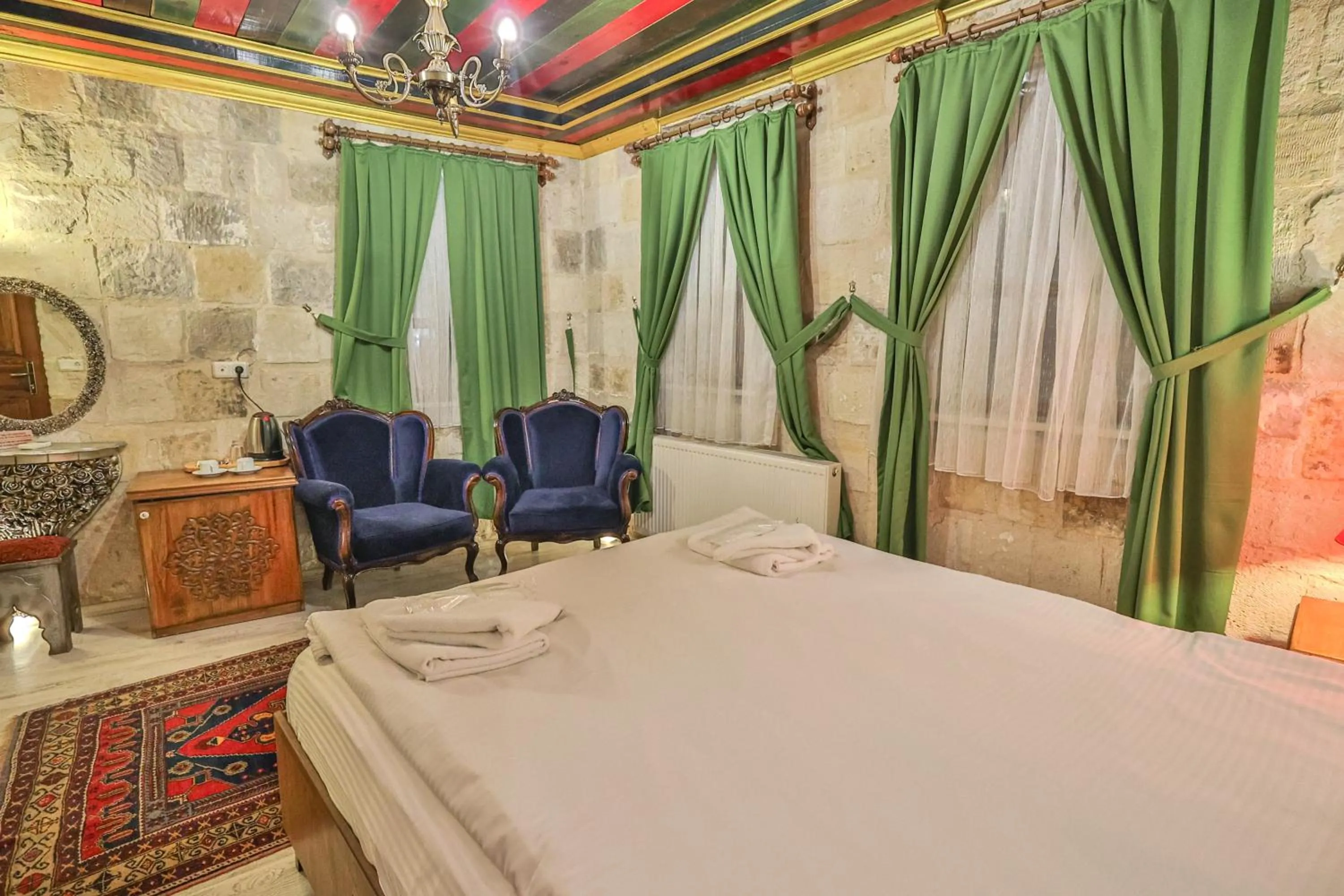 Bed in Bedrock Cave Hotel