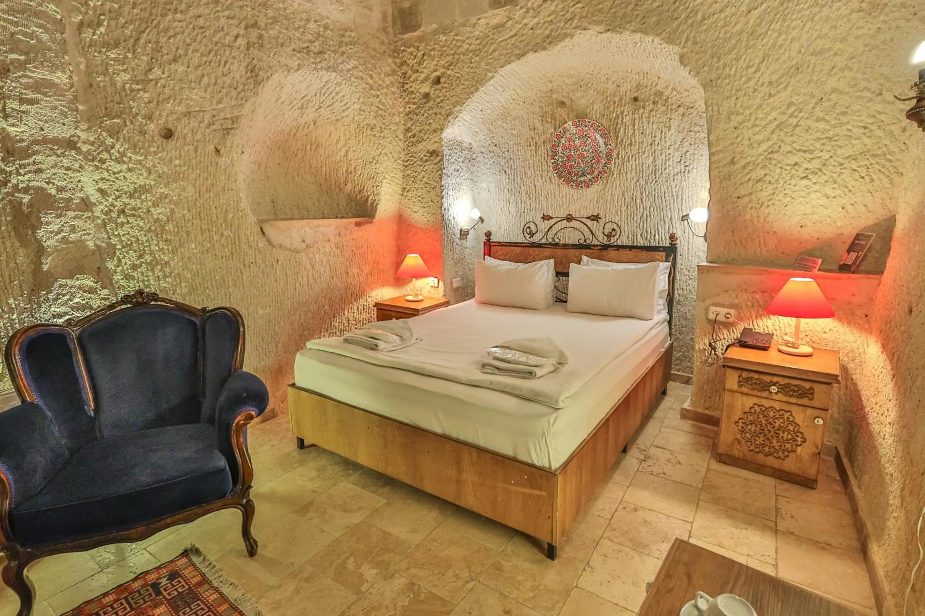 Bed in Bedrock Cave Hotel