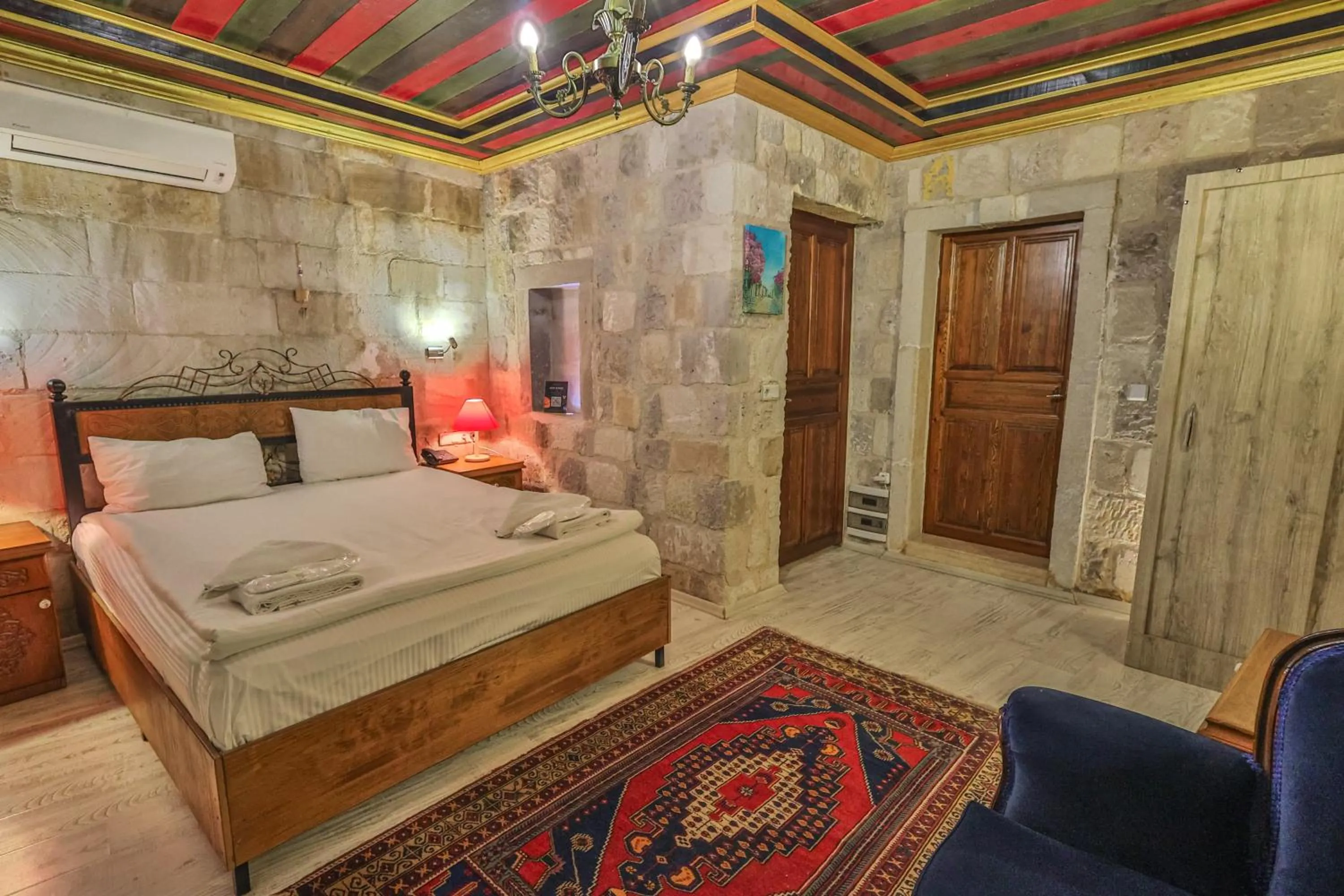 Bed in Bedrock Cave Hotel